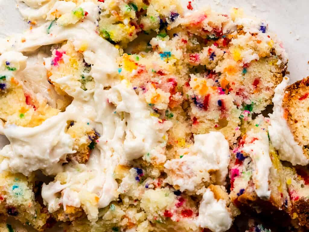 close up of funfetti cake with frosting 