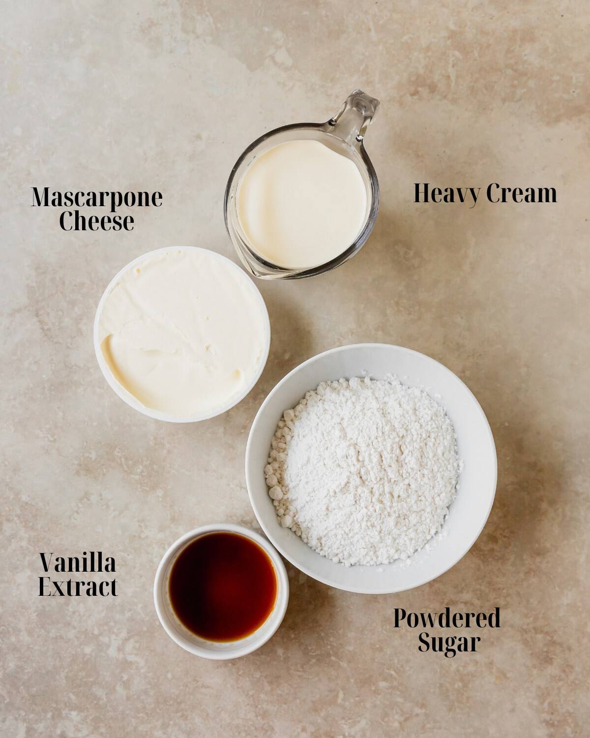 Gather mascarpone cheese, powdered sugar, vanilla extract and heavy cream. 