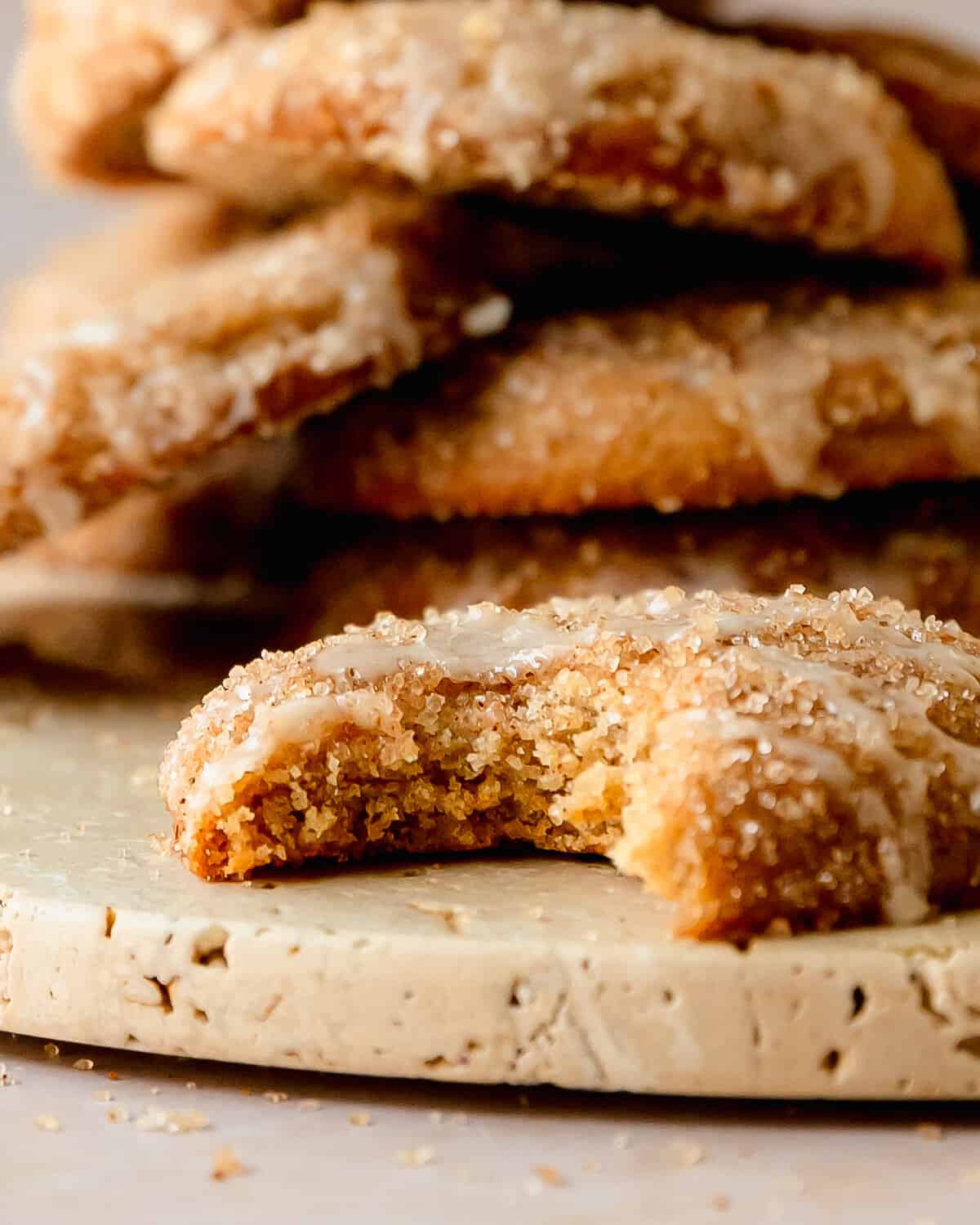 Apple cider cookies taste like apple cider donuts in cookie form. They’re soft and chewy cider filled sugar cookies, coated in an apple cider butter, rolled in cinnamon sugar and topped with an apple cider glaze.  What I love most about these glazed cider sugar cookies are that they require minimal chilling time and are super easy to make. They’re are the perfect cozy fall cookie everyone will love!