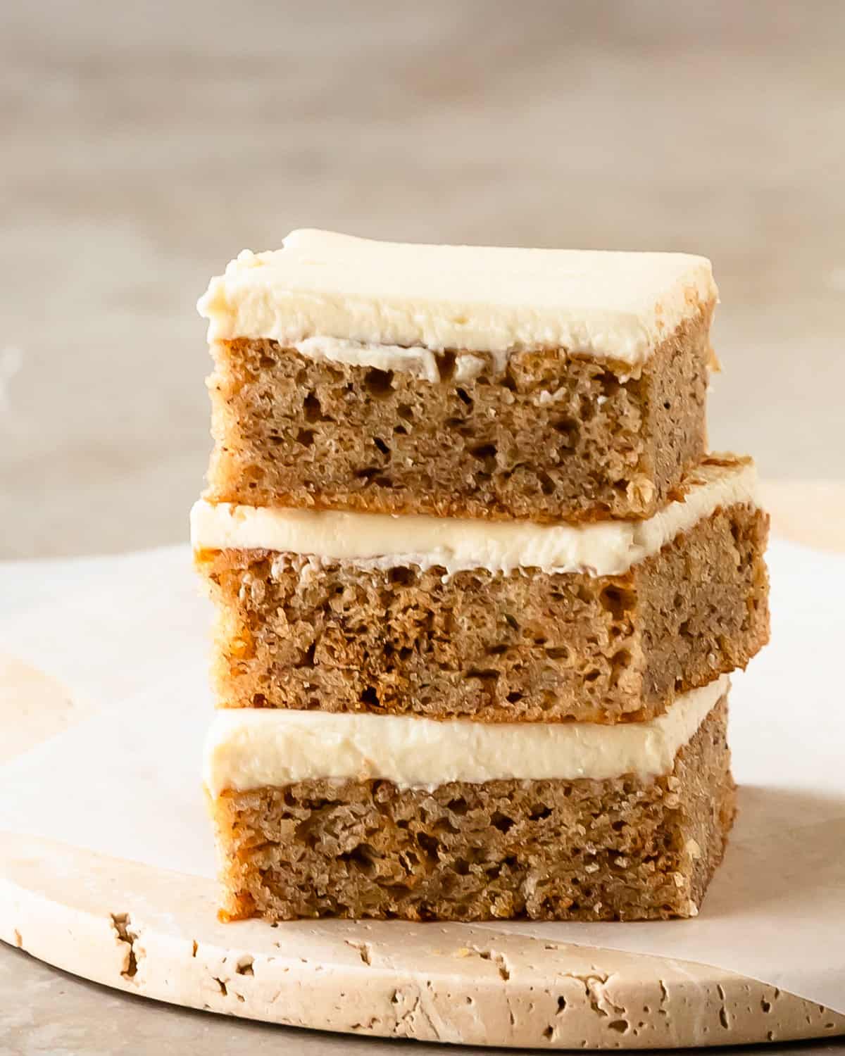 Banana bars with cream cheese frosting are soft, moist and flavorful banana cake bars; topped with a rich and sweet cream cheese frosting. Grab two bowls and a whisk to make this sheet cake banana bars recipe the next time you need a quick and easy dessert that everyone is sure to love!