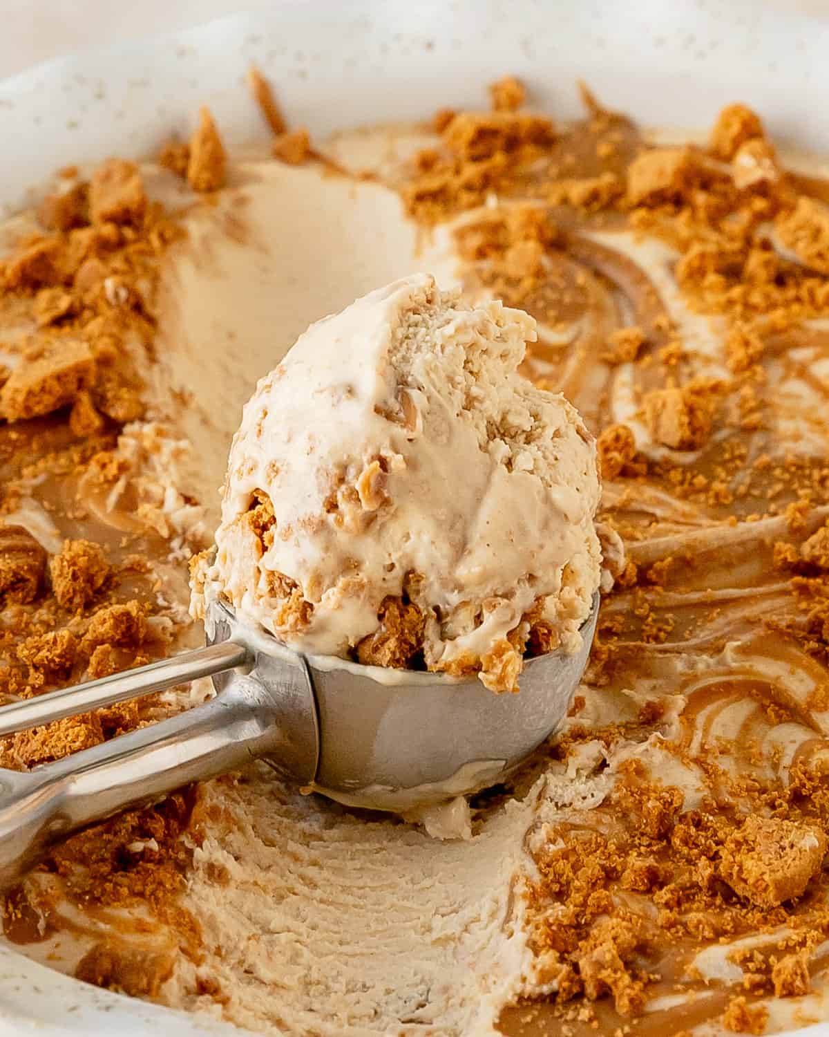 Biscoff ice cream is a creamy, cookie butter ice cream filled with swirls of cookie butter and crushed Lotus Biscoff cookies. Learn how to make Lotus ice cream in a few easy steps with just a few simple ingredients. It’s an easy no churn ice cream recipe everyone will love!
