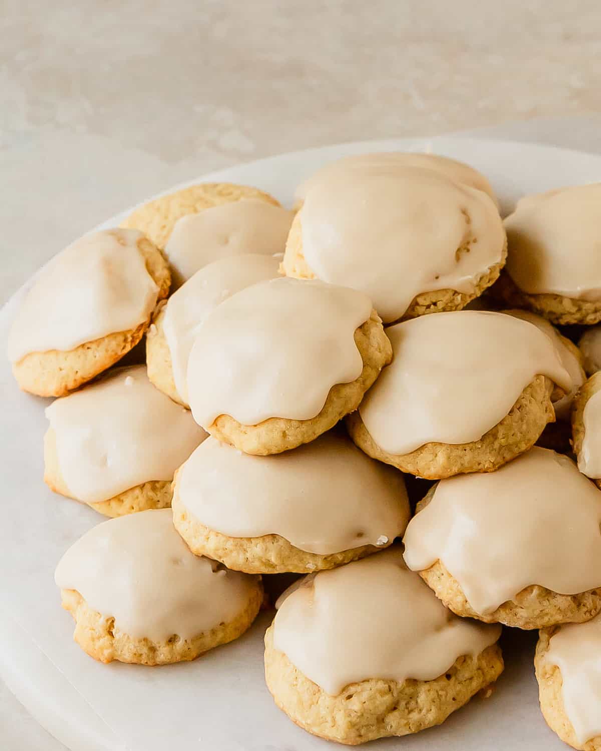 Buttermilk cookies are soft vanilla cookies with a tender, cakey crumb. Also known as Amish cookies, these buttermilk sugar cookies are topped with a sweet and slightly tangy buttermilk glaze.  Since these cookies with buttermilk are quick and easy to make, they are the perfect easy treat when you are craving something a sweet and a little old fashioned.