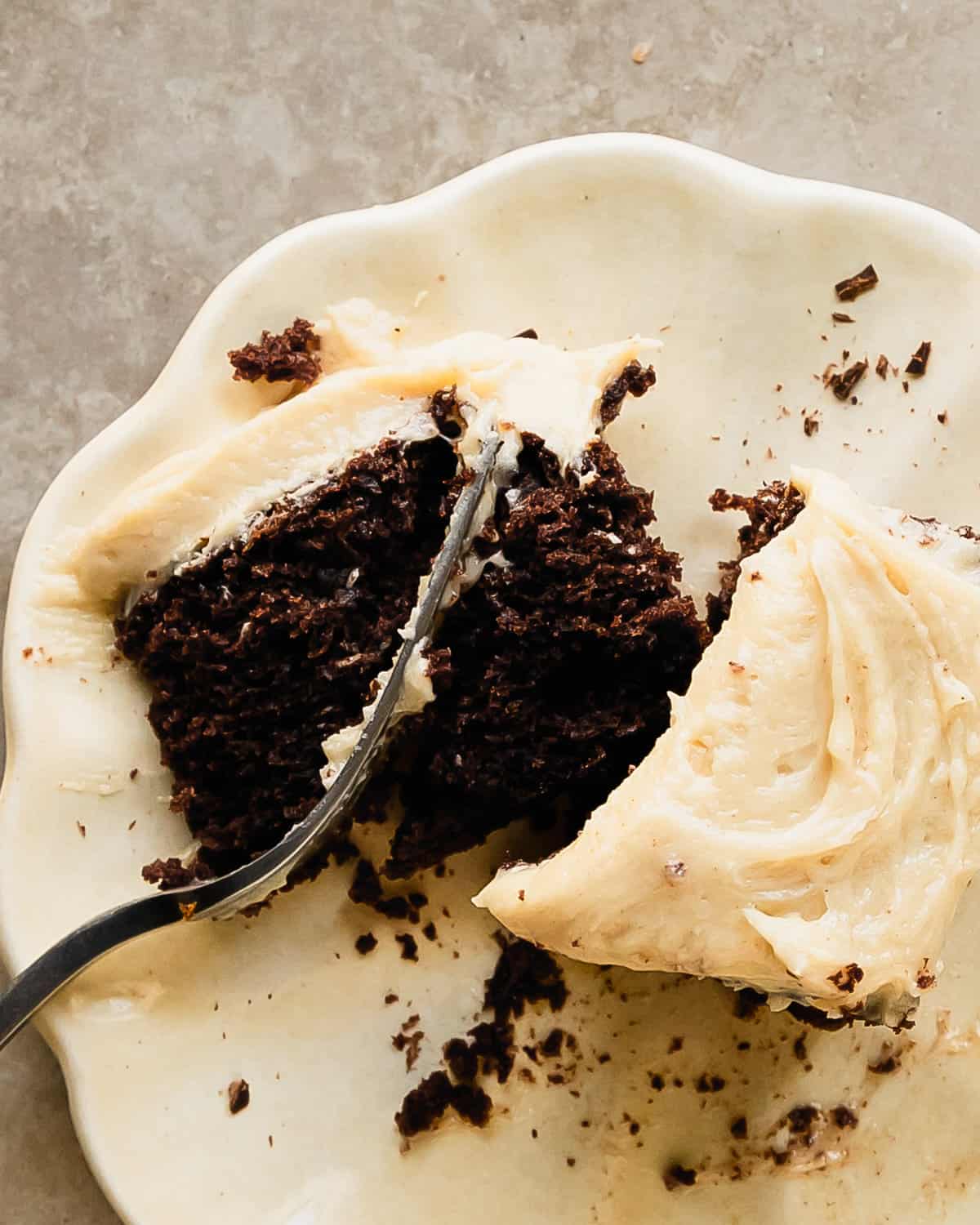 Chocolate banana cake is a moist and tender, from scratch chocolate cake filled with banana flavor. It’s topped with a rich and decadent peanut butter cream cheese frosting and shaved chocolate. This banana chocolate cake is not only quick and simple to make using two bowls and a whisk, it’s also the easy perfect cake for any occasion.