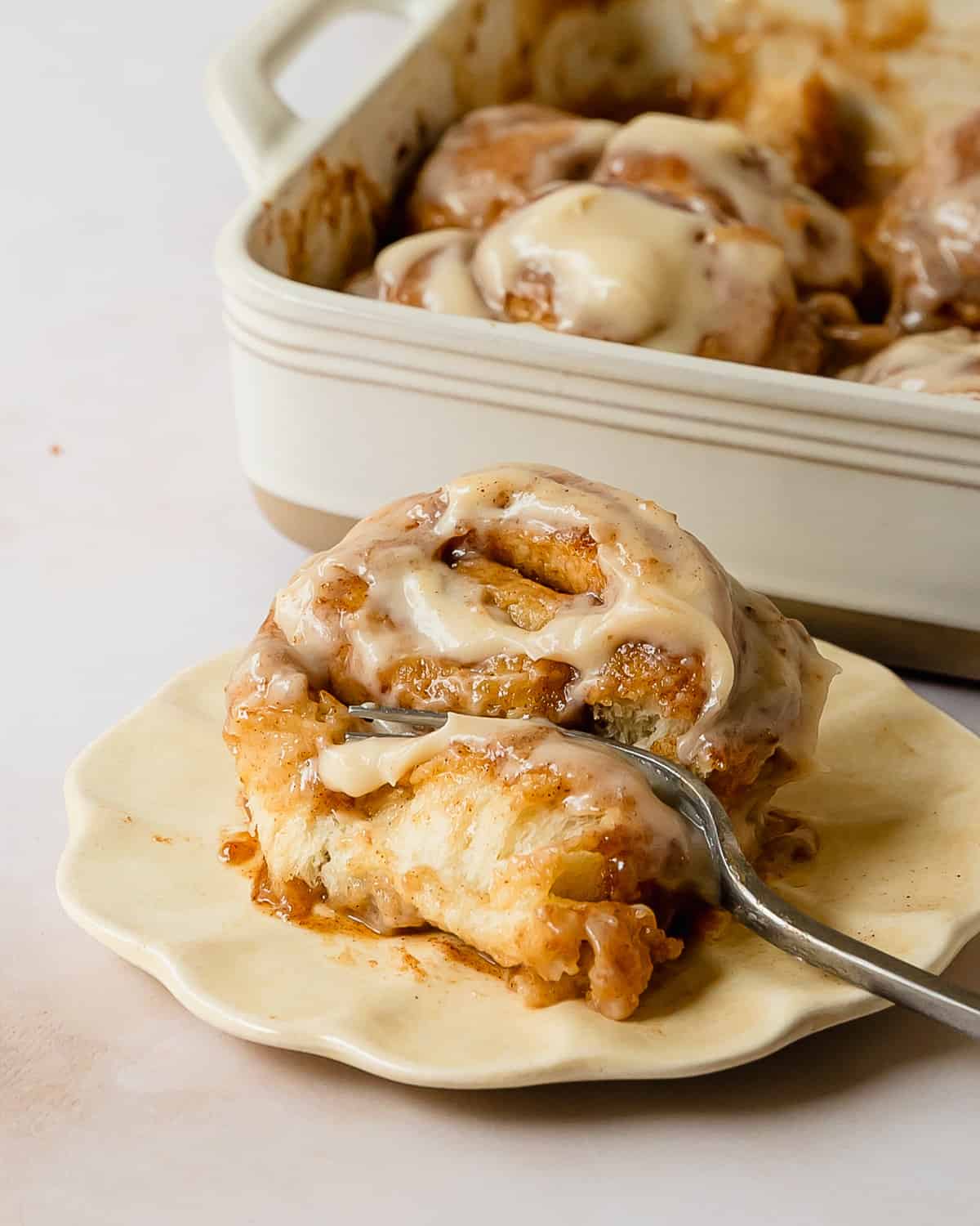Cinnamon rolls with heavy cream is a clever and easy to make Tik Tok cinnamon roll hack that transforms canned cinnamon buns into light, fluffy and moist, bakery worthy cinnamon rolls. These deliciously gooey cinnamon rolls are topped with a brown sugar and cinnamon butter before baking and with a luscious cream cheese icing after baking. Grab your favorite store bought cinnamon rolls and make a decadent and easy breakfast treat everyone is sure to love!
