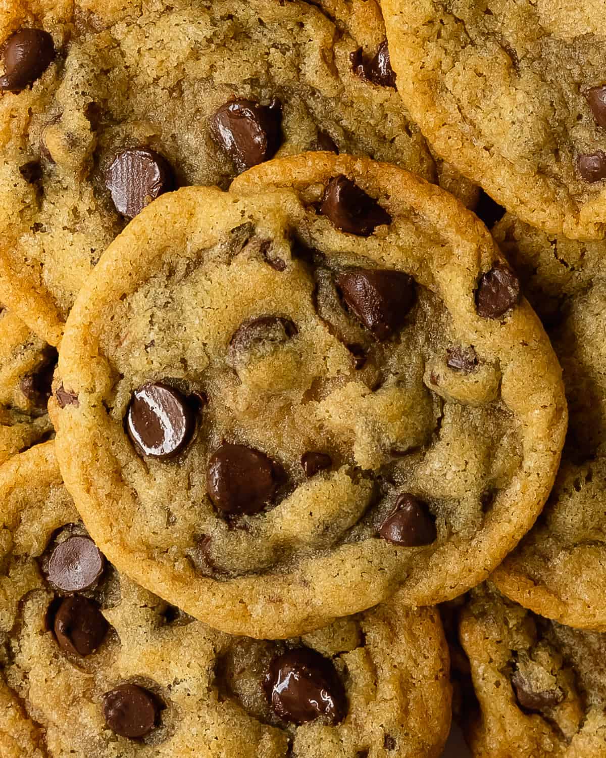 These eggless chocolate chip cookies have crisp, buttery edges with soft, chewy centers and tons of melty chocolate chips. This recipe for eggless cookies uses all the same ingredients of  classic chocolate chip cookies just  with no eggs.  They are the best egg free chocolate chip cookie ever!  