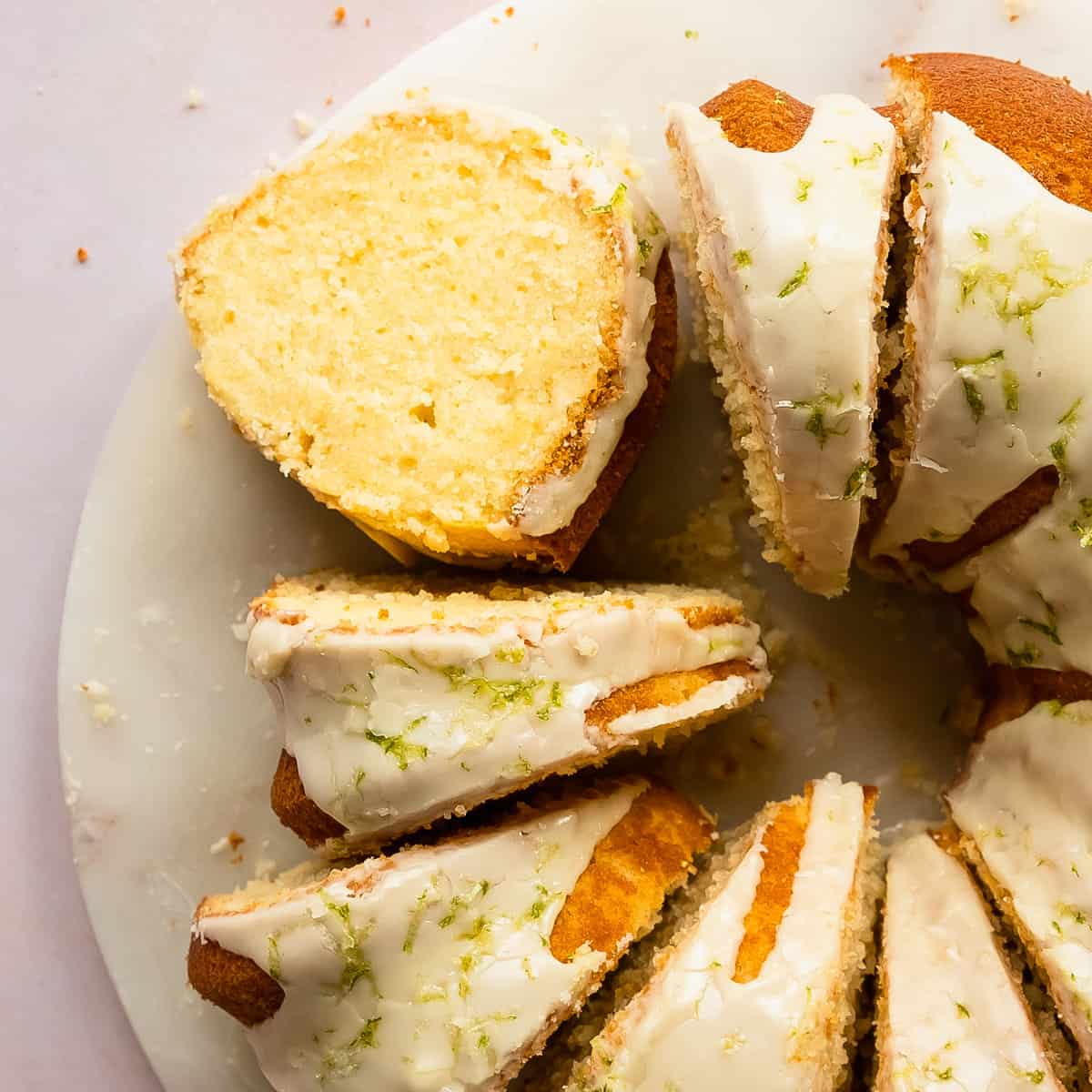 This key lime pound cake is a decadent, rich and buttery pound cake filled with key lime flavor. Top with this lime pound cake with a deliciously tart and sweet key lime glaze. Enjoy this easy to make, tropical twist on the classic southern pound cake for breakfast, brunch or dessert. 