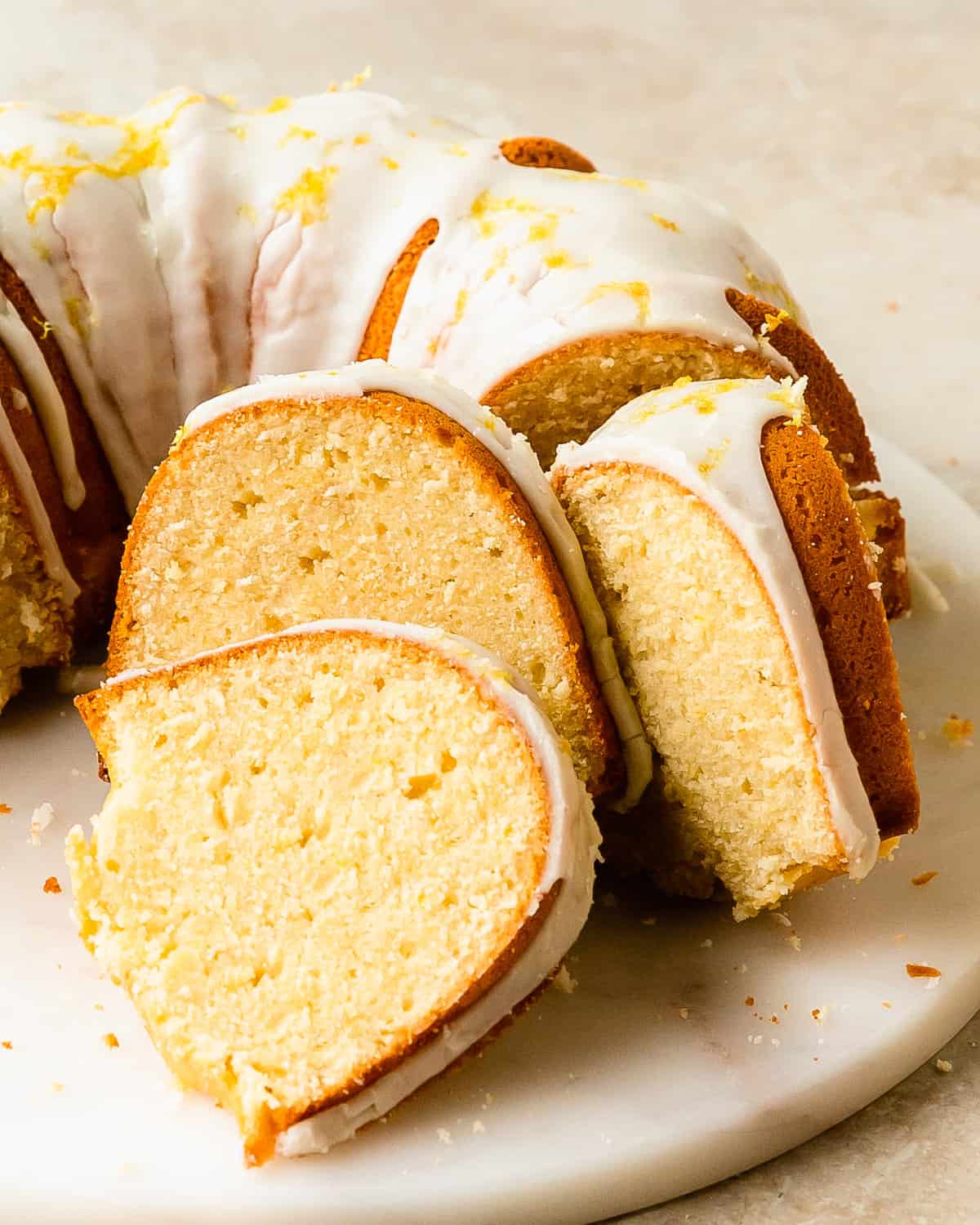 Lemon cream cheese pound cake is a decadent, dense and buttery lemon pound cake made with cream cheese. Top this lemon cake with a sweet and tart lemon glaze for even more lemon flavor. Enjoy this easy to make, old fashioned lemon pound cake for breakfast, brunch or dessert.