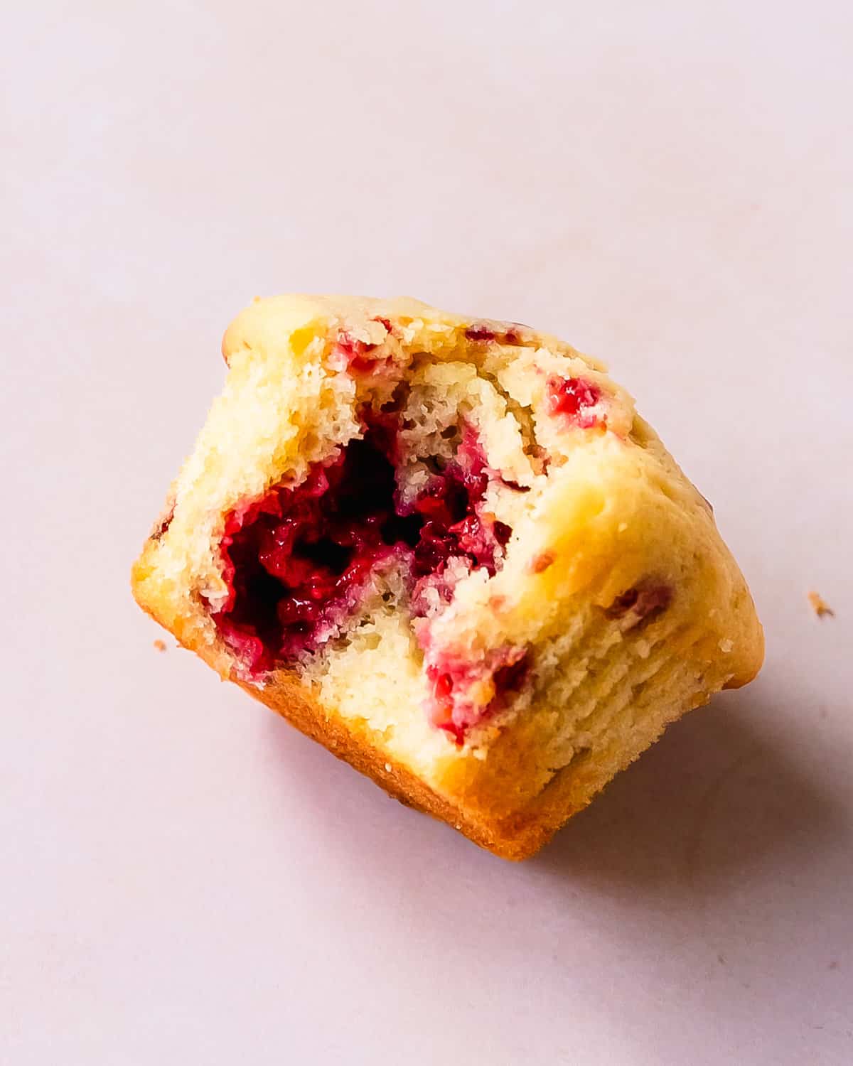 These raspberry muffins are light, fluffy and incredibly moist bakery style muffins filled with fresh or frozen raspberries and a hint of lemon.