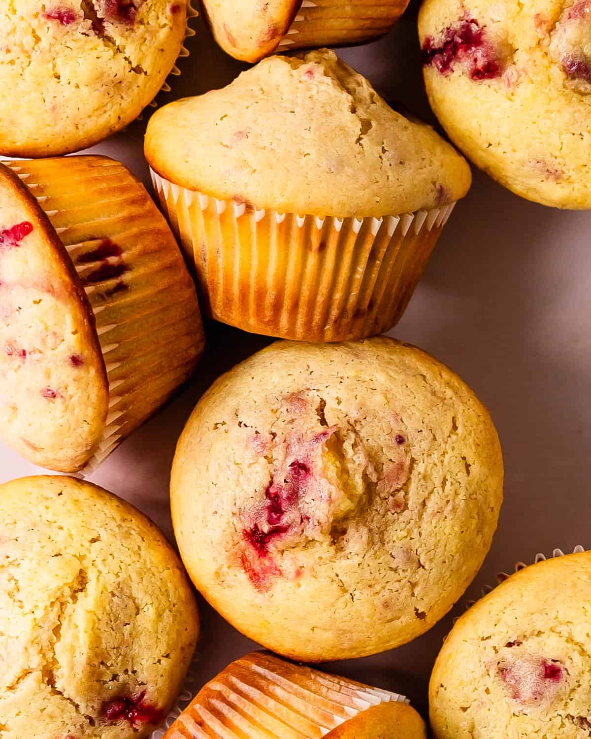 These raspberry muffins are light, fluffy and incredibly moist bakery style muffins filled with fresh or frozen raspberries and a hint of lemon.  