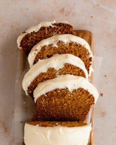 Pumpkin Bread with Cream Cheese Frosting slices with frosting showing.
