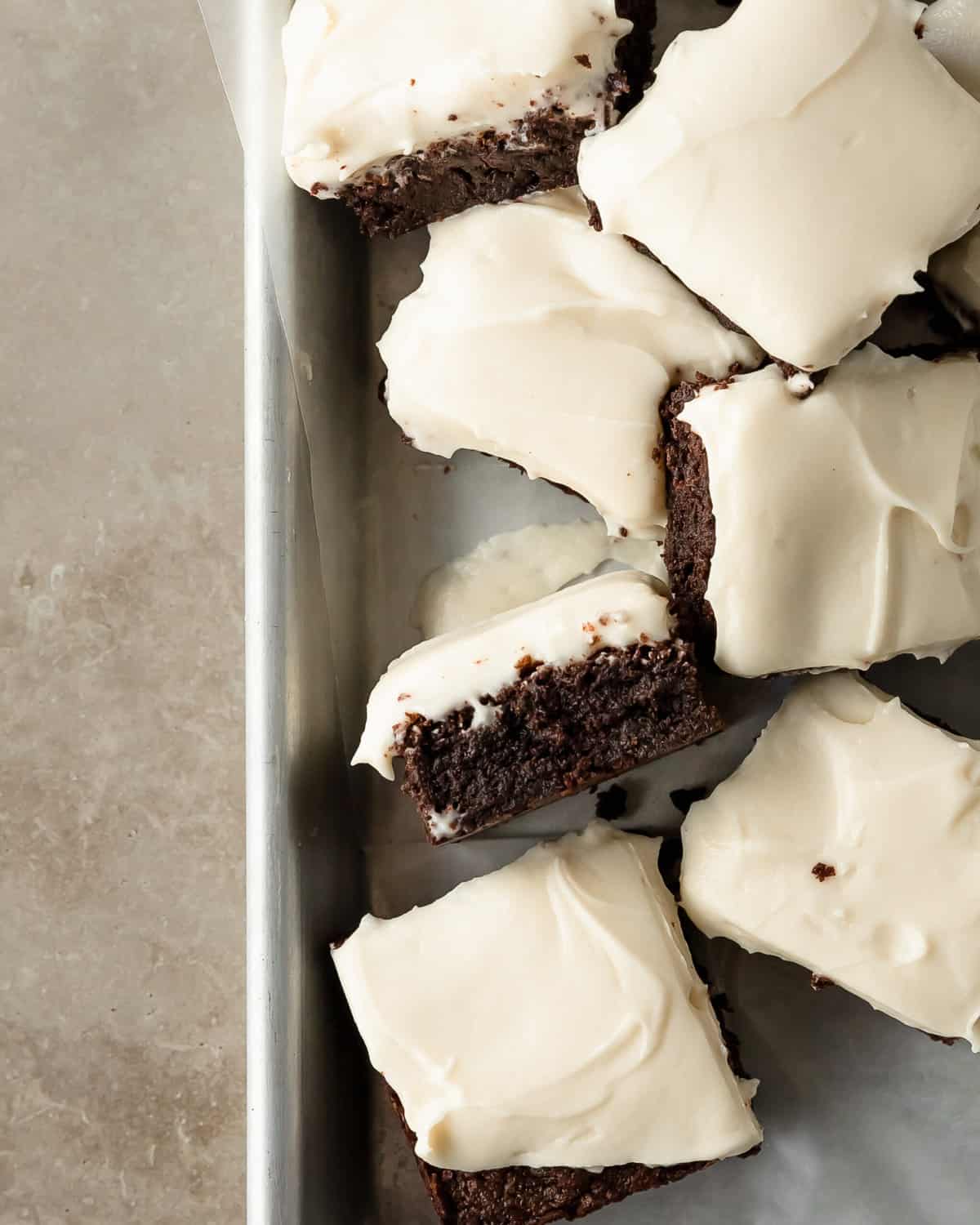 Brownies with Cream Cheese frosting on a sheet pan. 