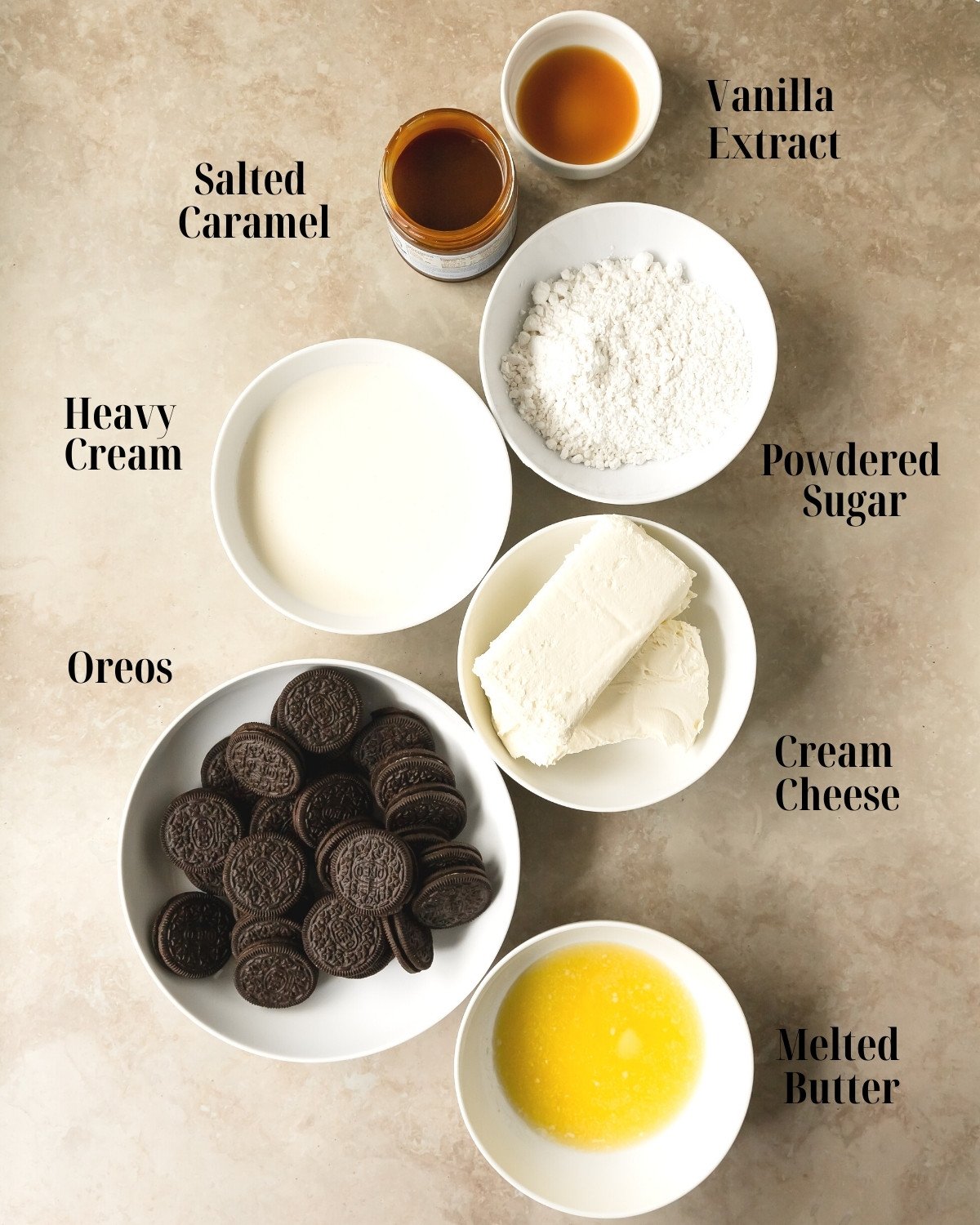 Ingredients:  Gather cream cheese, heavy whipping cream,powdered sugar, salted caramel, vanilla extract salt, chocolate sandwich cookies and melted butter. 
