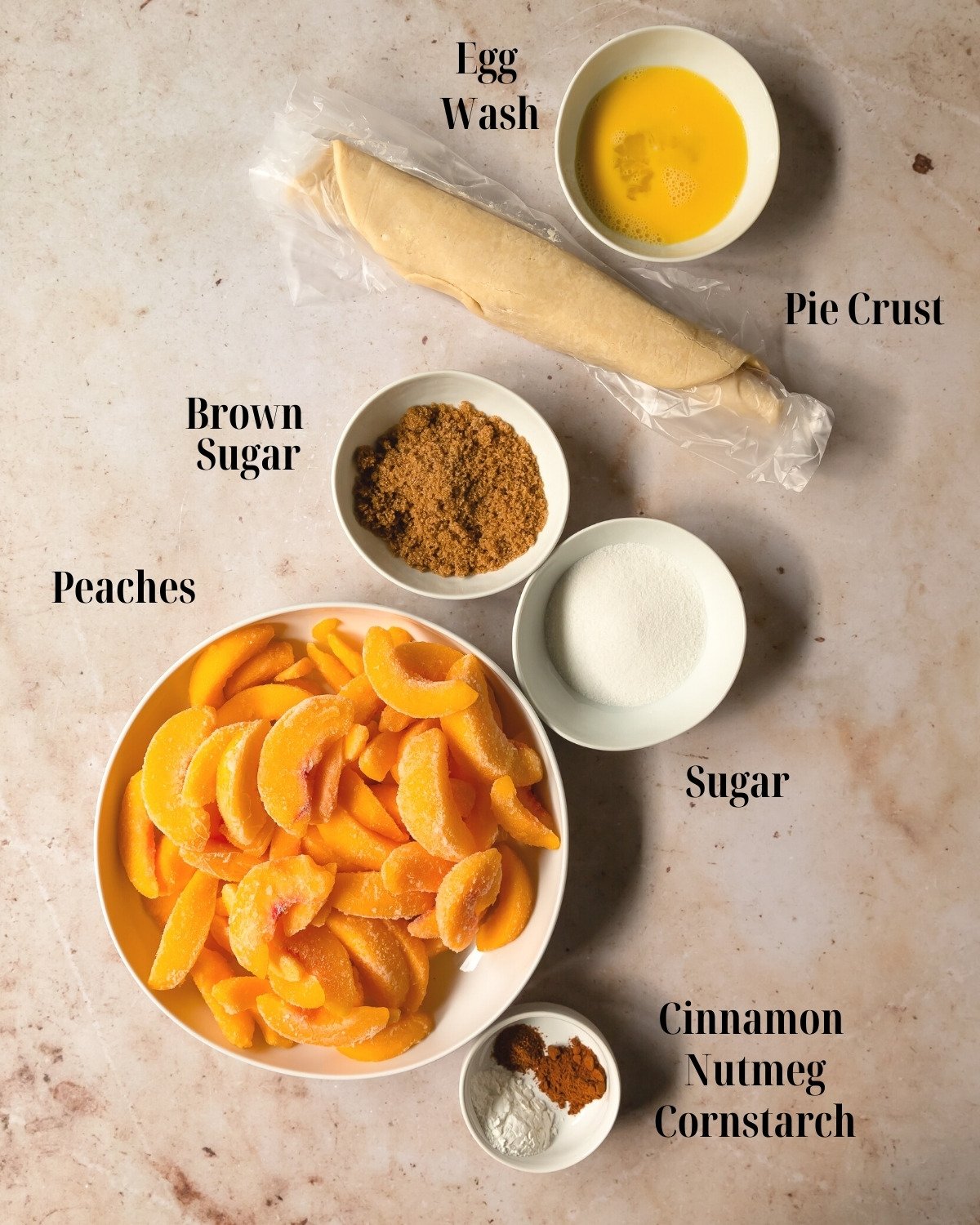The main ingredients for this peach cobbler with pie crust recipe are homemade or store bought pie crust, fresh or frozen peaches, brown sugar, granulated sugar, ground cinnamon, nutmeg and cornstarch. 