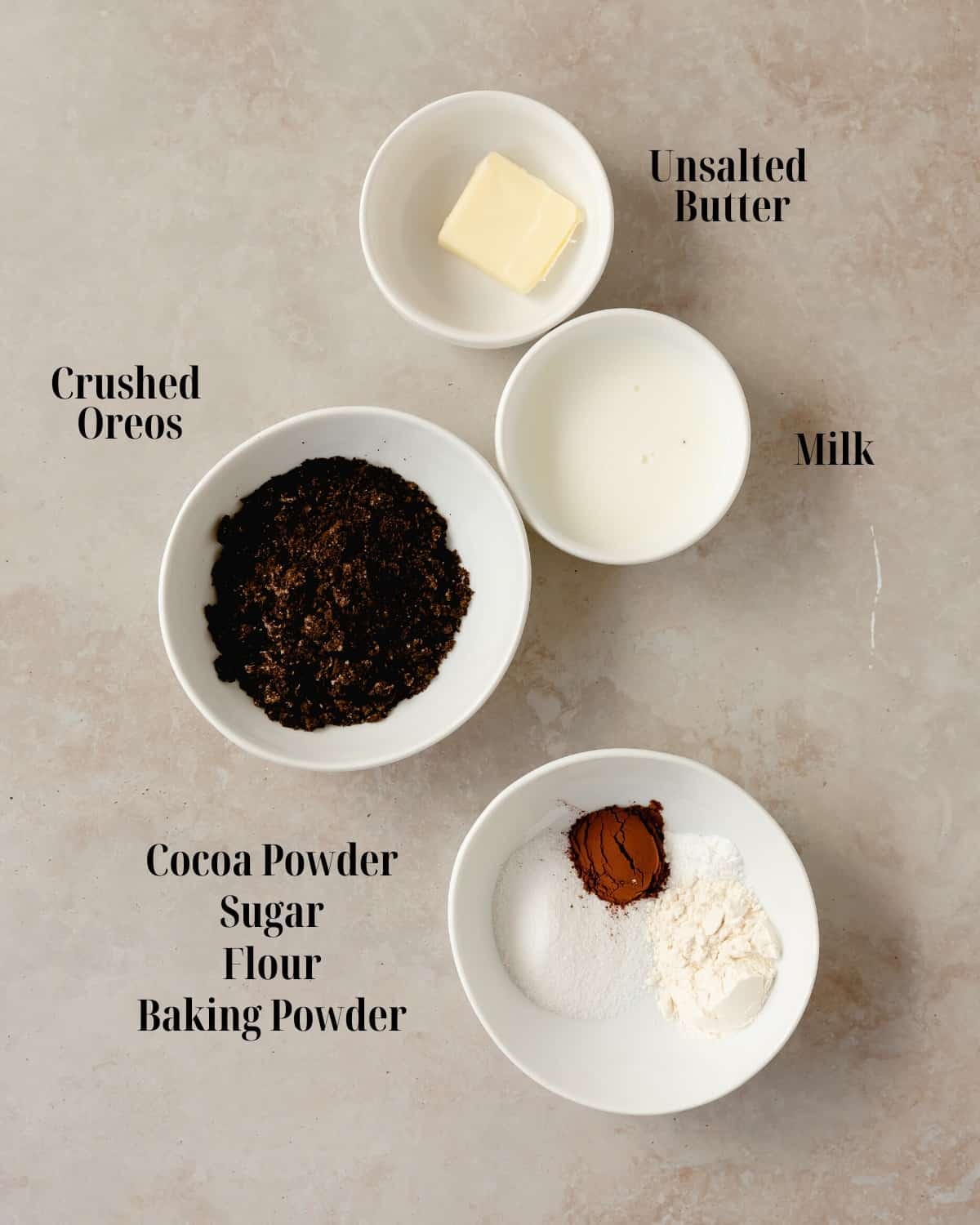 Gather crushed Oreo cookies, milk, butter, cocoa powder, sugar, flour and baking powder. 