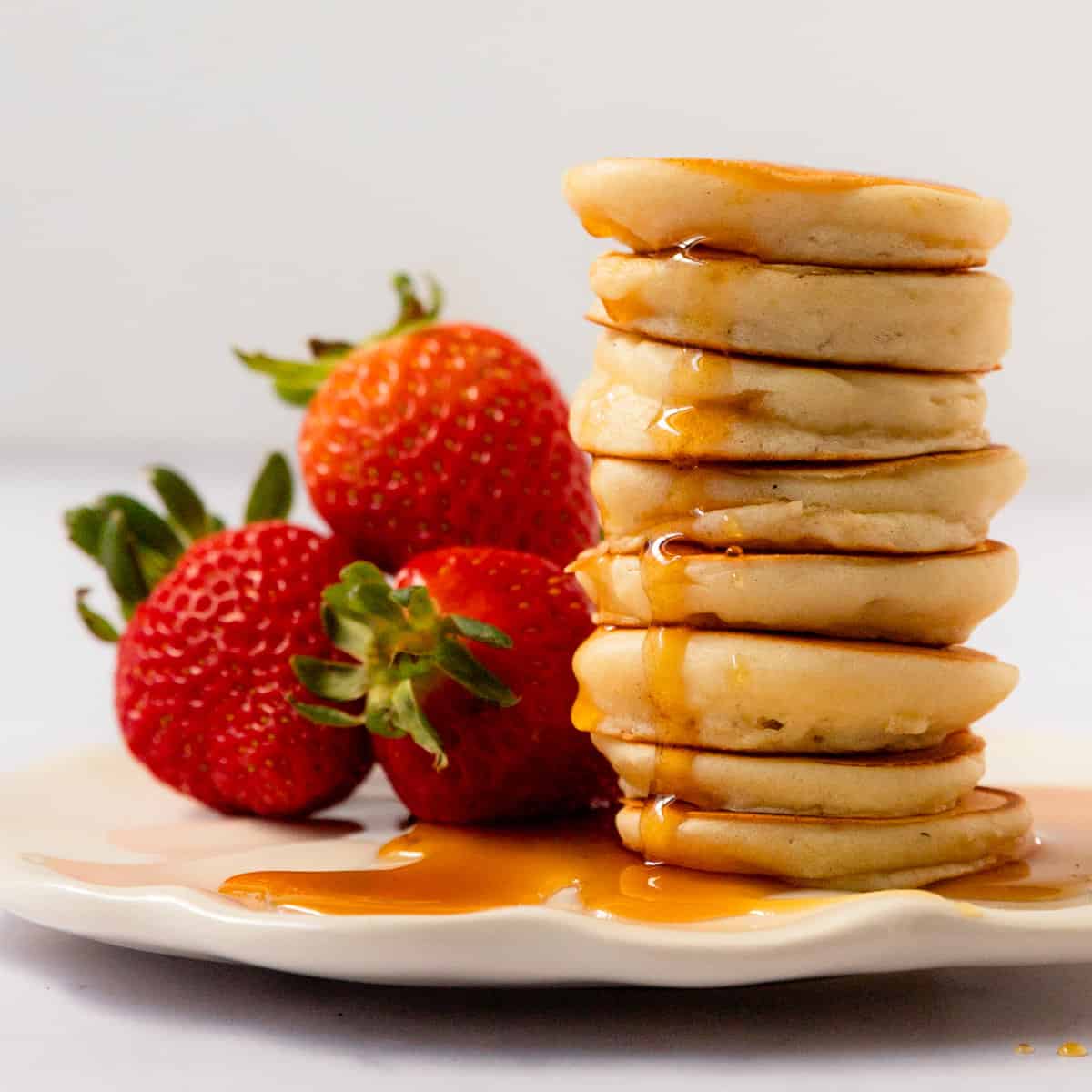 These mini pancakes are light and fluffy silver dollar pancakes. They're fun, kid friendly, quick, easy to make and perfect for breakfast.