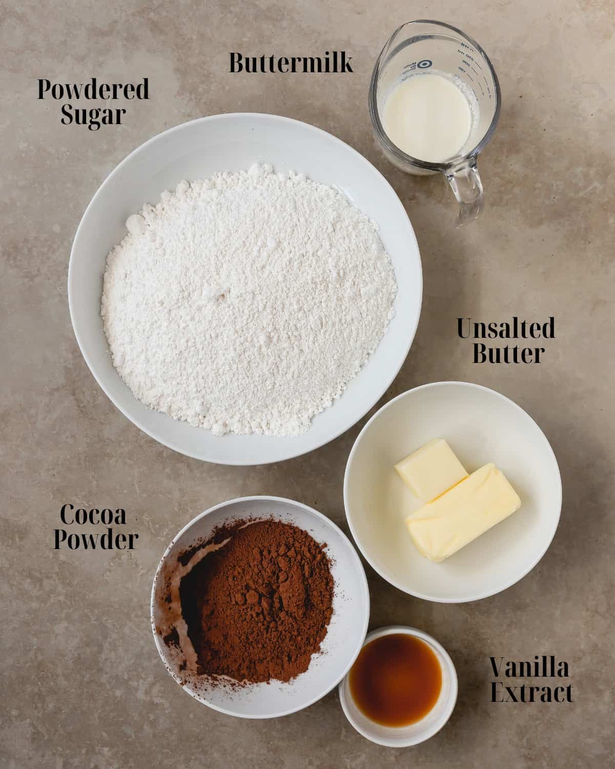 Gather butter, cocoa powder, buttermilk, vanilla extract and powdered sugar. 