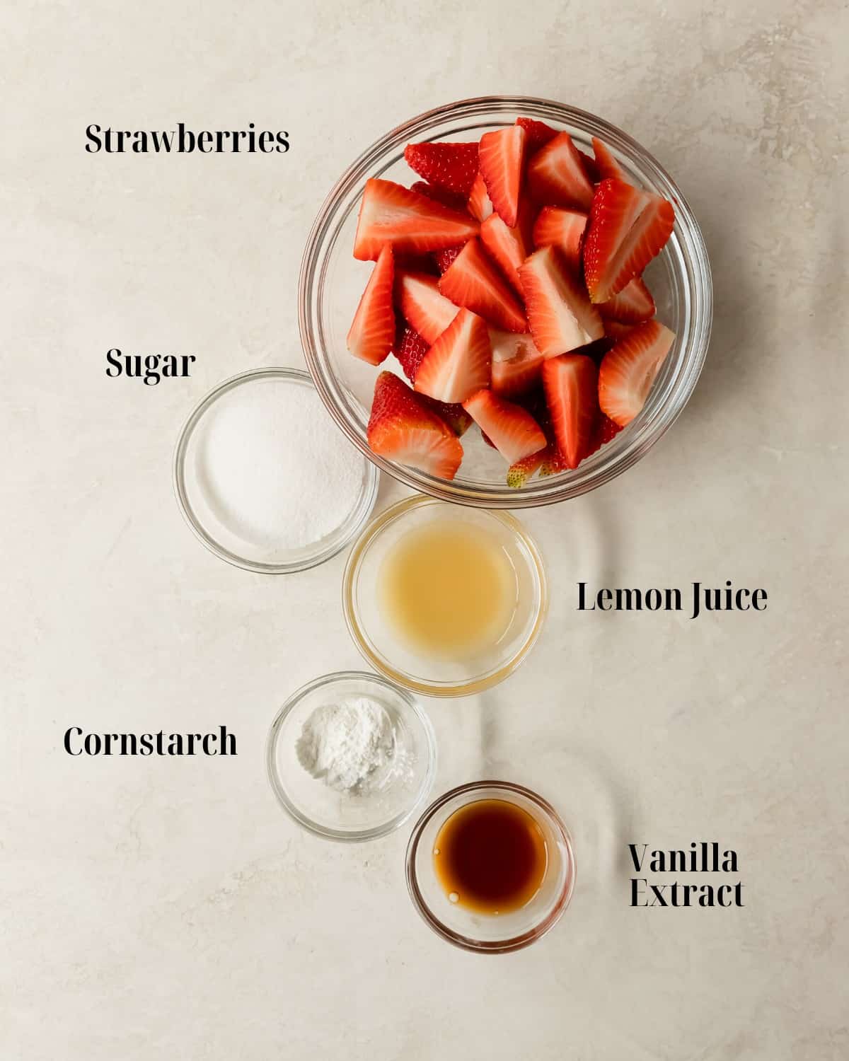 Gather strawberries, sugar, cornstarch, lemon juice and vanilla extract. 