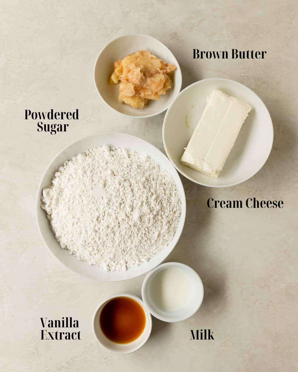 Gather unsalted butter, cream cheese, powdered sugar, vanilla extract, milk and salt. 