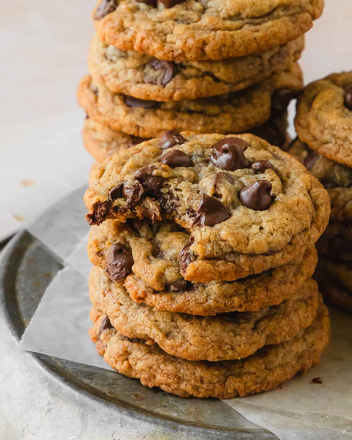 Banana chocolate chip cookies are moist banana bread cookies filled with melty chocolate chips. These chocolate chip banana cookies are soft and chewy with the perfect balance of cake like texture. What I love most about these brown butter banana chocolate chip cookies is how easy they are to make with minimal ingredients. They’re the perfect cozy cookie everyone will love!