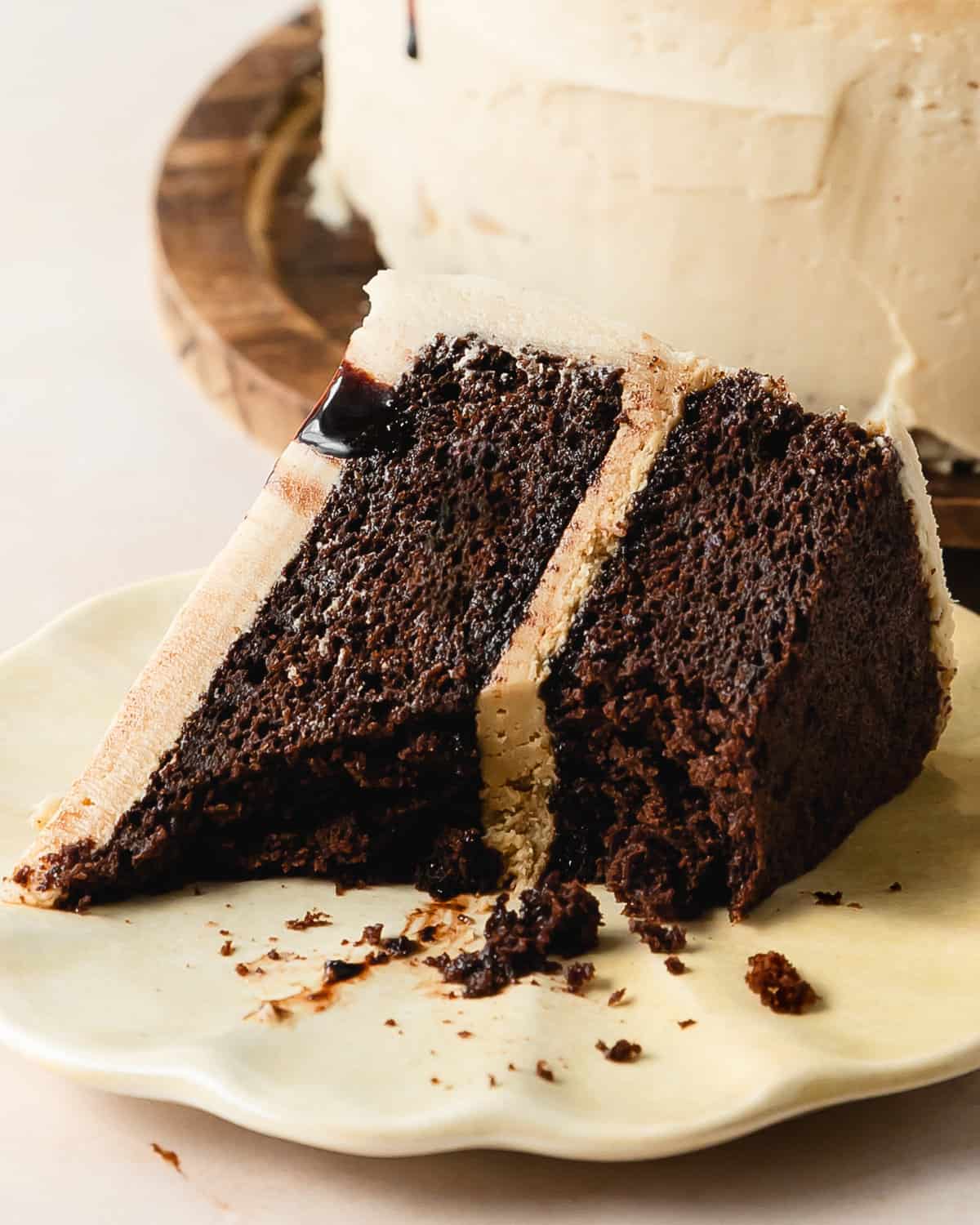 Chocolate coffee cake is a moist espresso chocolate cake infused with a sweet simple coffee syrup, layered with a creamy coffee buttercream. Drizzle the top of this layered coffee cake with extra coffee syrup for even more coffee flavor. This decadent and bakery worthy chocolate cake  is super simple to make and is perfect for any celebration.