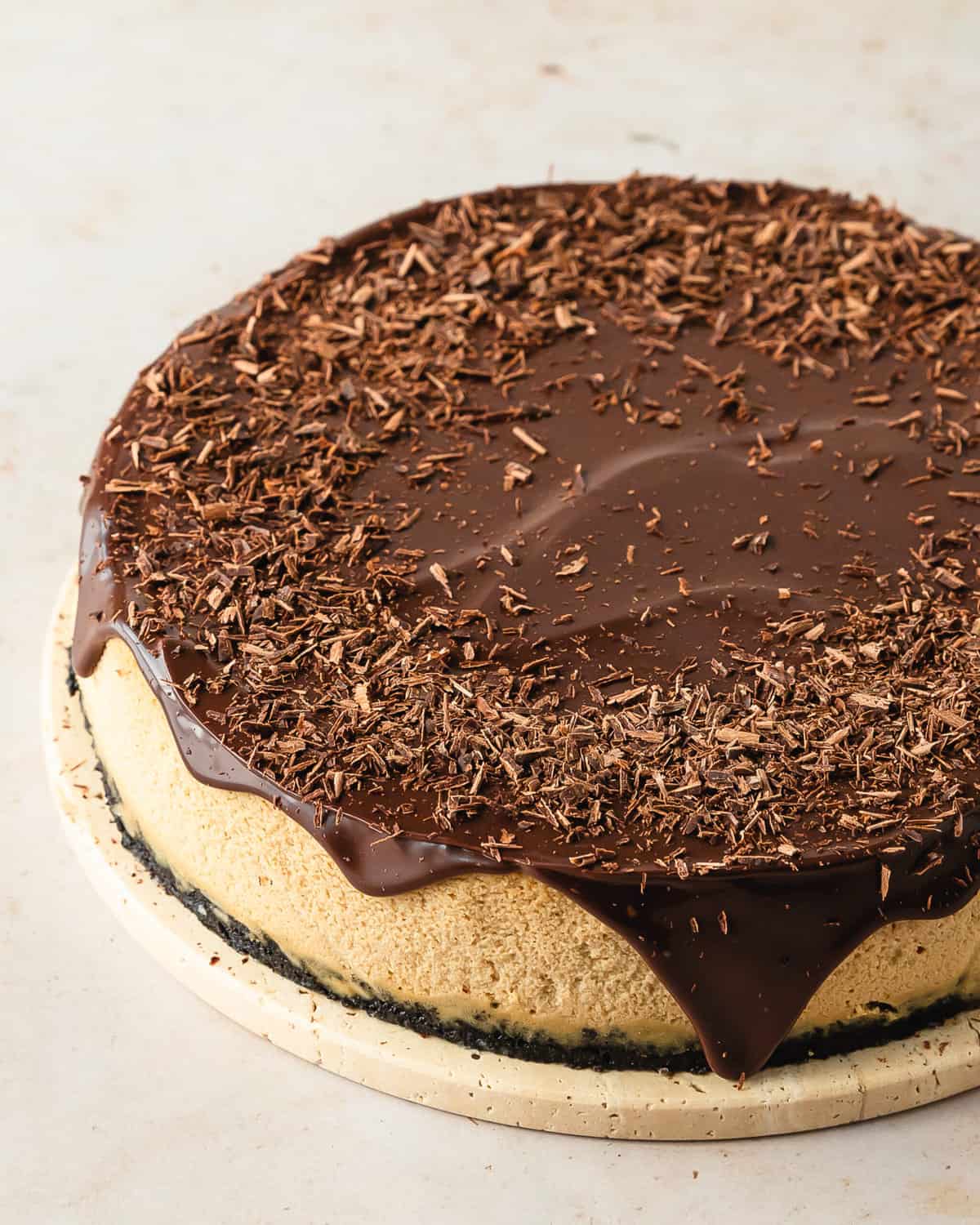 Coffee cheesecake is a smooth and creamy espresso cheesecake with an espresso chocolate cookie crust. For even more decadent coffee flavor, this espresso cheesecake is topped with an easy chocolate coffee ganache. Make this chocolate espresso cheesecake the next time you need a deliciously decadent dessert that’s perfect for the coffee and cheesecake lover in your life.