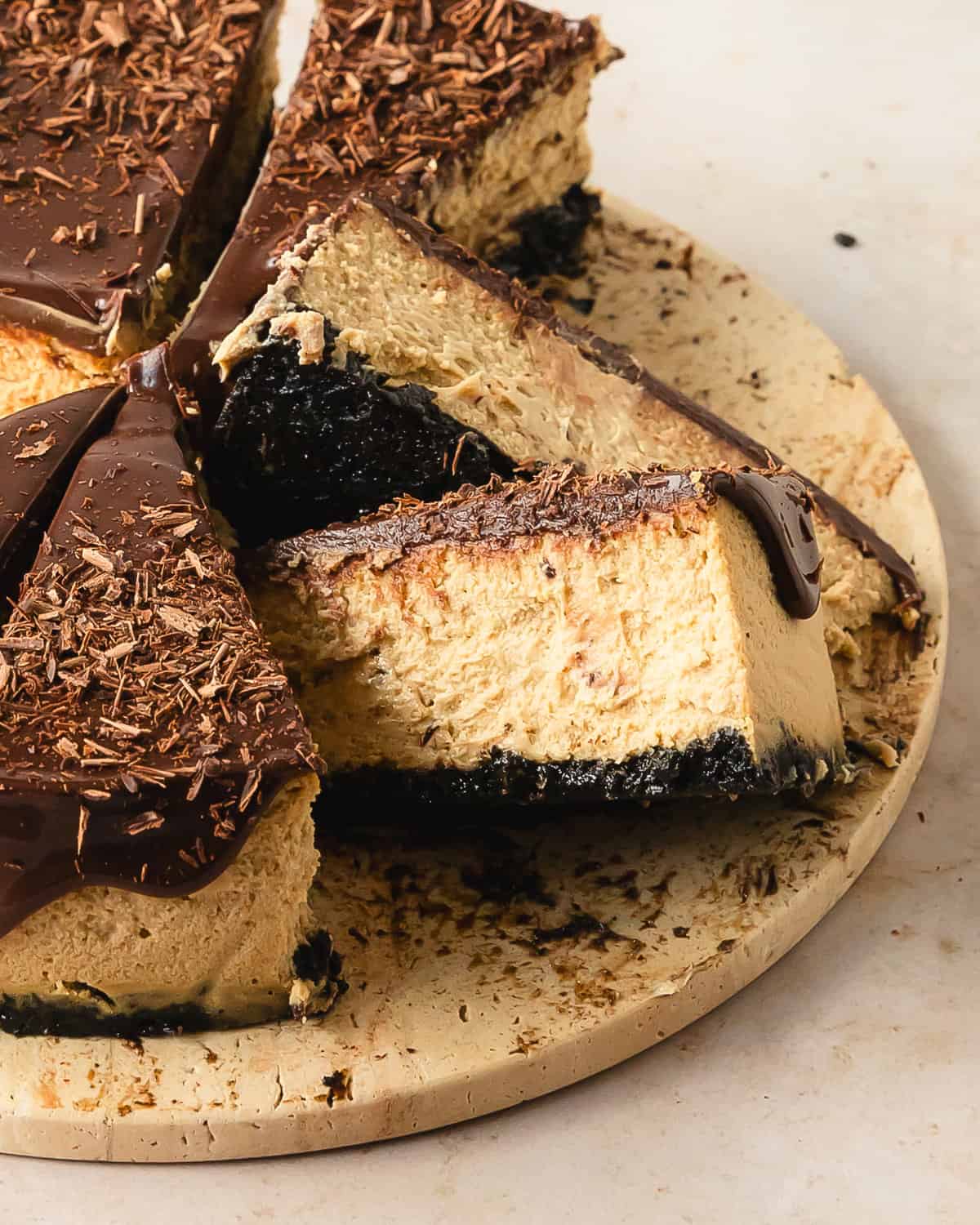 Coffee cheesecake is a smooth and creamy espresso cheesecake with an espresso chocolate cookie crust. For even more decadent coffee flavor, this espresso cheesecake is topped with an easy chocolate coffee ganache. Make this chocolate espresso cheesecake the next time you need a deliciously decadent dessert that’s perfect for the coffee and cheesecake lover in your life.  