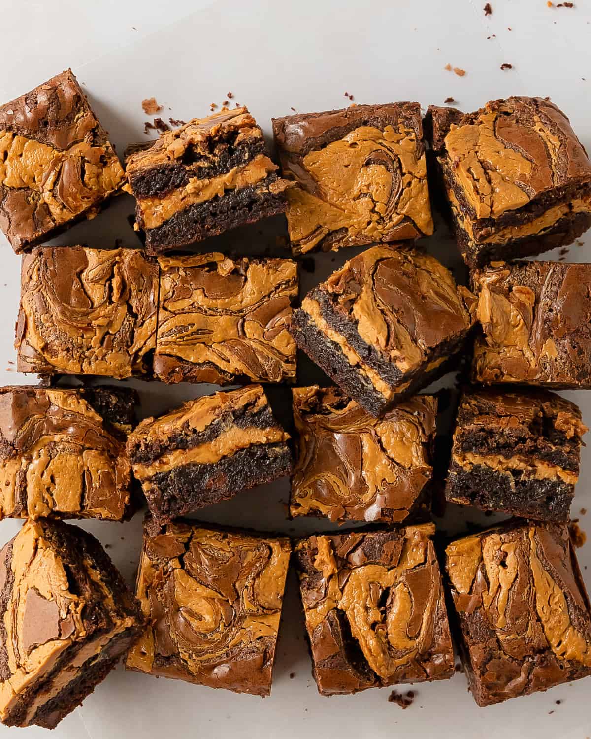 Peanut butter brownies are rich and fudgy brownies stuffed with a layer of creamy peanut butter filling. Top these easy and chewy stuffed brownies with swirls of peanut butter for even more decadent chocolate and peanut butter cup flavor. 