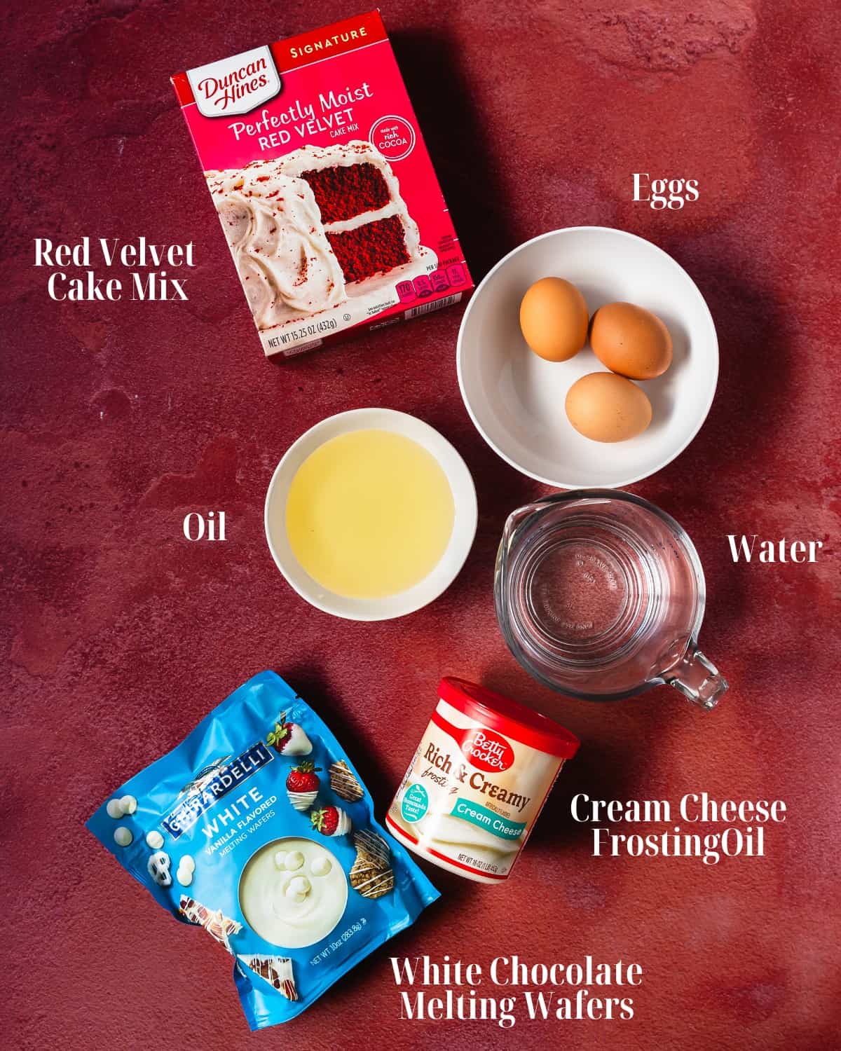 Gather your preferred red velvet cake mix (plus oil, eggs and water for store box cake mix ), cream cheese frosting and white chocolate melting wafers. .
