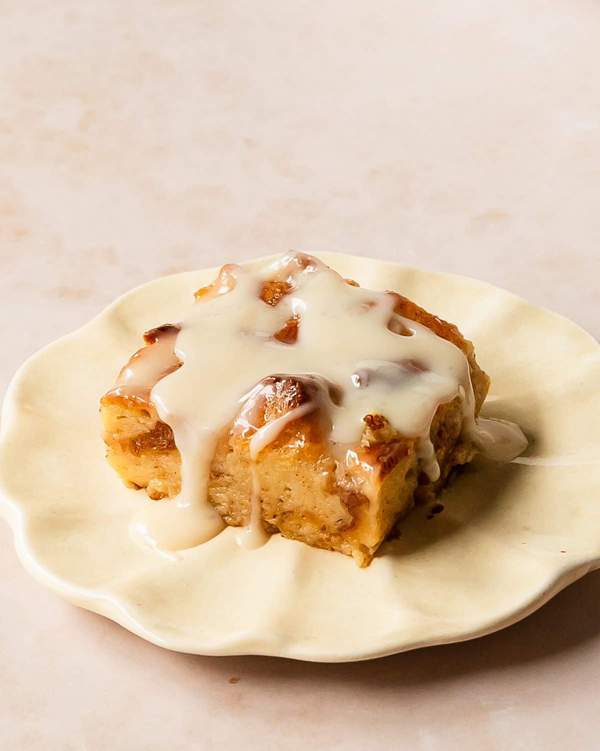 Bread pudding with vanilla sauce is a rich, baked custard and bread dessert, topped with a classic silky vanilla butter sauce right before serving. This quick and easy bread pudding makes the perfect weekend treat or a special holiday breakfast or dessert.