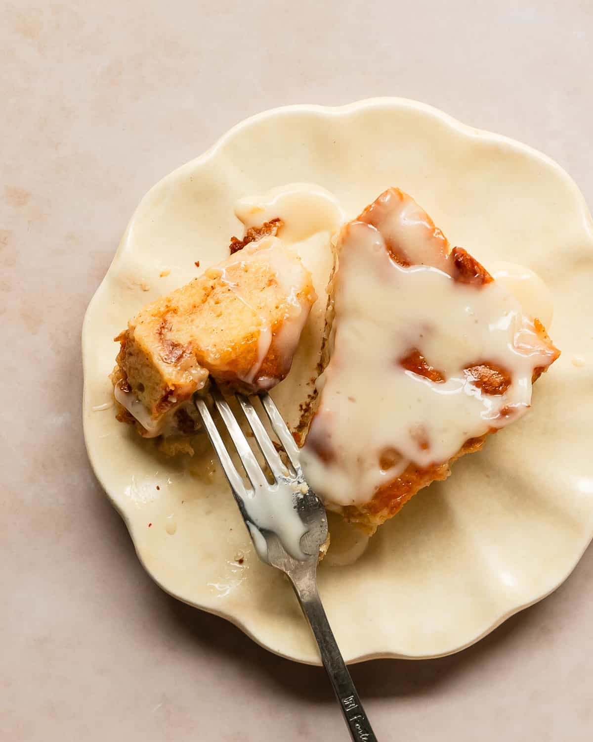 Bread pudding with vanilla sauce is a rich, baked custard and bread dessert, topped with a classic silky vanilla butter sauce right before serving. This quick and easy bread pudding makes the perfect weekend treat or a special holiday breakfast or dessert. 