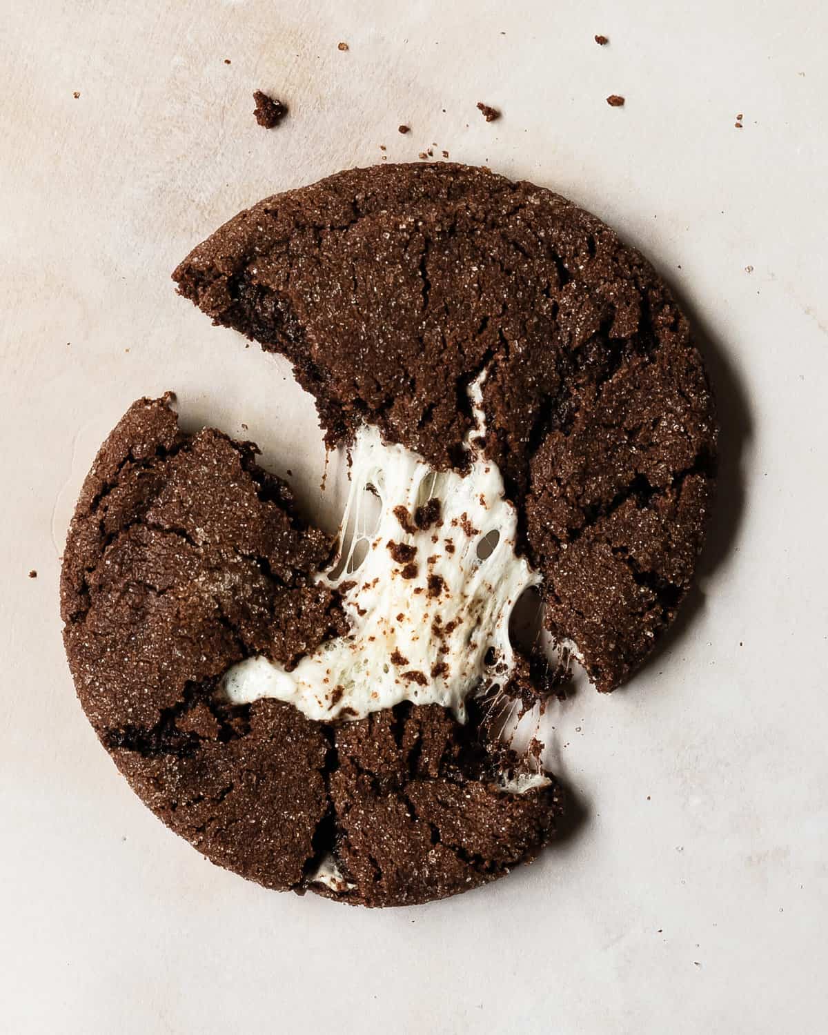Chocolate marshmallow cookies are fudgy and chewy double chocolate sugar cookies filled with gooey marshmallows, rolled in a sweet, crunchy sugar coating. These marshmallow cookies are incredibly quick and easy to make and taste just like your favorite hot cocoa with marshmallows.