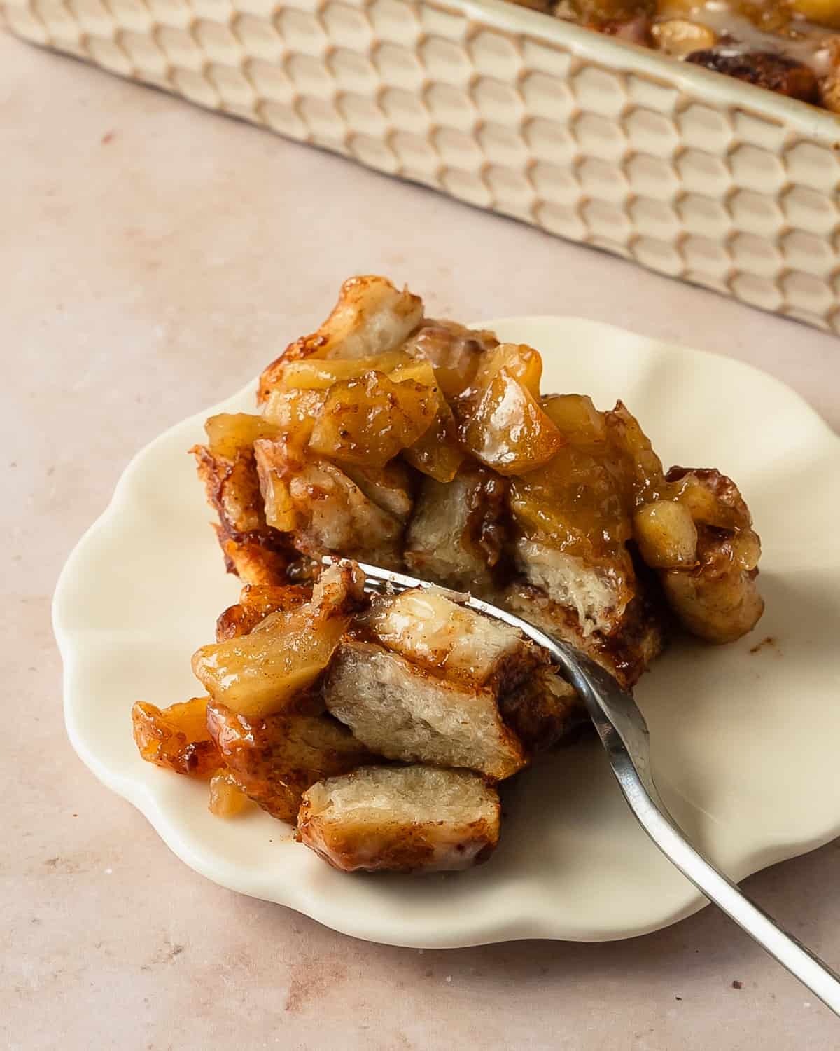 Cinnamon rolls and apple pie filling is an almost 2 ingredient cinnamon roll bake filled with warm apple pie sauce and chunks of sweet, gooey apples. This quick and easy apple pie cinnamon roll cobbler makes the perfect weekend treat or a special holiday breakfast or dessert.