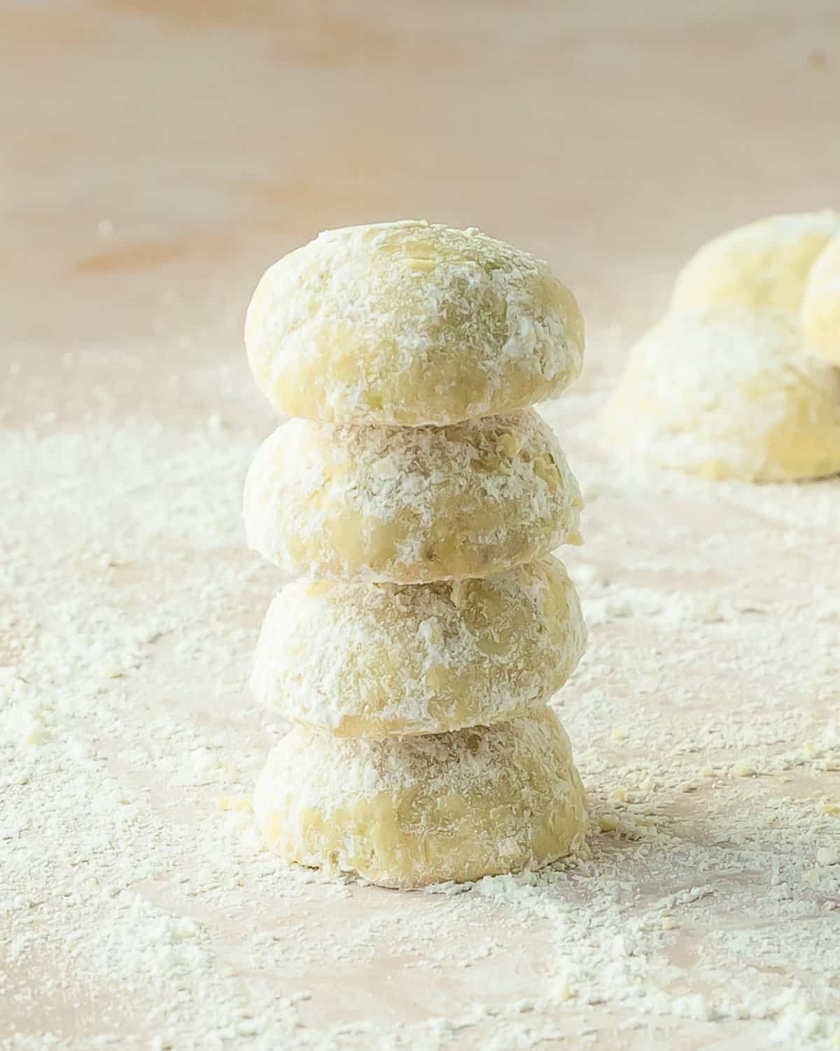 Pistachio cookies are thick, soft and buttery drop cookies made with real pistachios. These pistachio drop cookies are coated in powdered sugar giving a fresh flavor twist to the classic snowball cookie. This recipe for pistachio cookies is quick and easy and makes the perfect festive cookie for any occasion. 