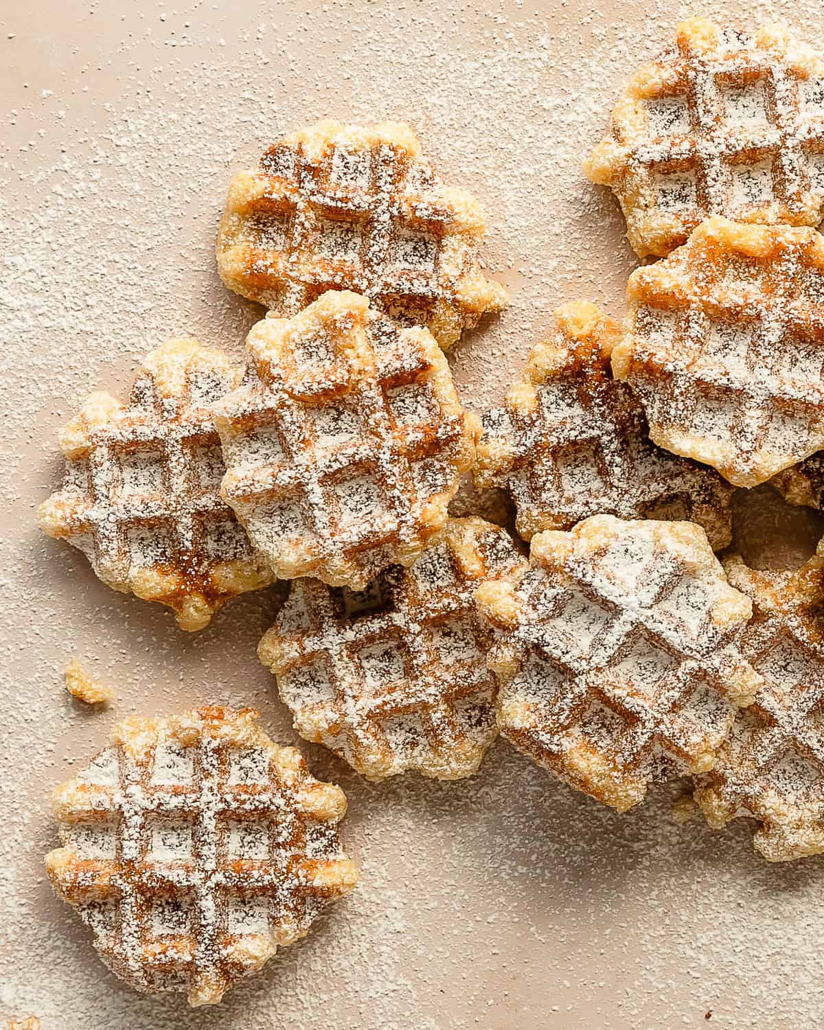 Waffle cookies area classic buttery vanilla sugar cookie cooked on a waffle iron. These easy cookie waffles have a soft buttery interior with a crisp golden brown exterior. What I love most about these fun and unique dutch waffle cookies is they are no chill and all you need to baked them is a waffle iron. 