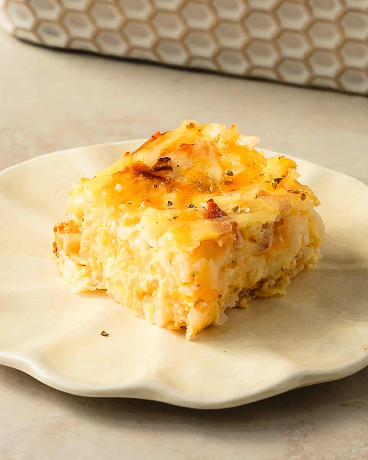 Amish breakfast casserole is a rich and hearty breakfast dish made from eggs, three kinds of cheese, hash browns and bacon.  It’s quick, easy to prepare and feeds a crowd.  Make this comforting cheesy egg bake for a weekend treat or as special holiday breakfast or brunch. 