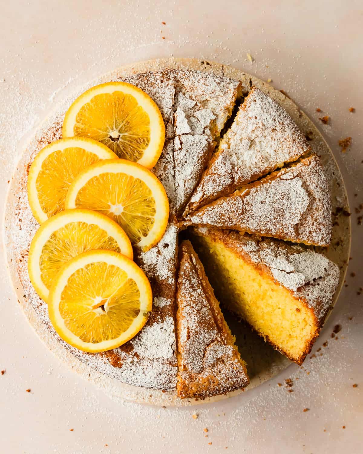 Orange olive oil cake is a deliciously tender and moist olive oil cake infused with bright orange flavor. This olive oil orange cake is made with orange zest and fresh orange juice and has a wonderfully rich and fluffy crumb. Make this citrus olive oil cake anytime you need a simple, but stunning dessert.