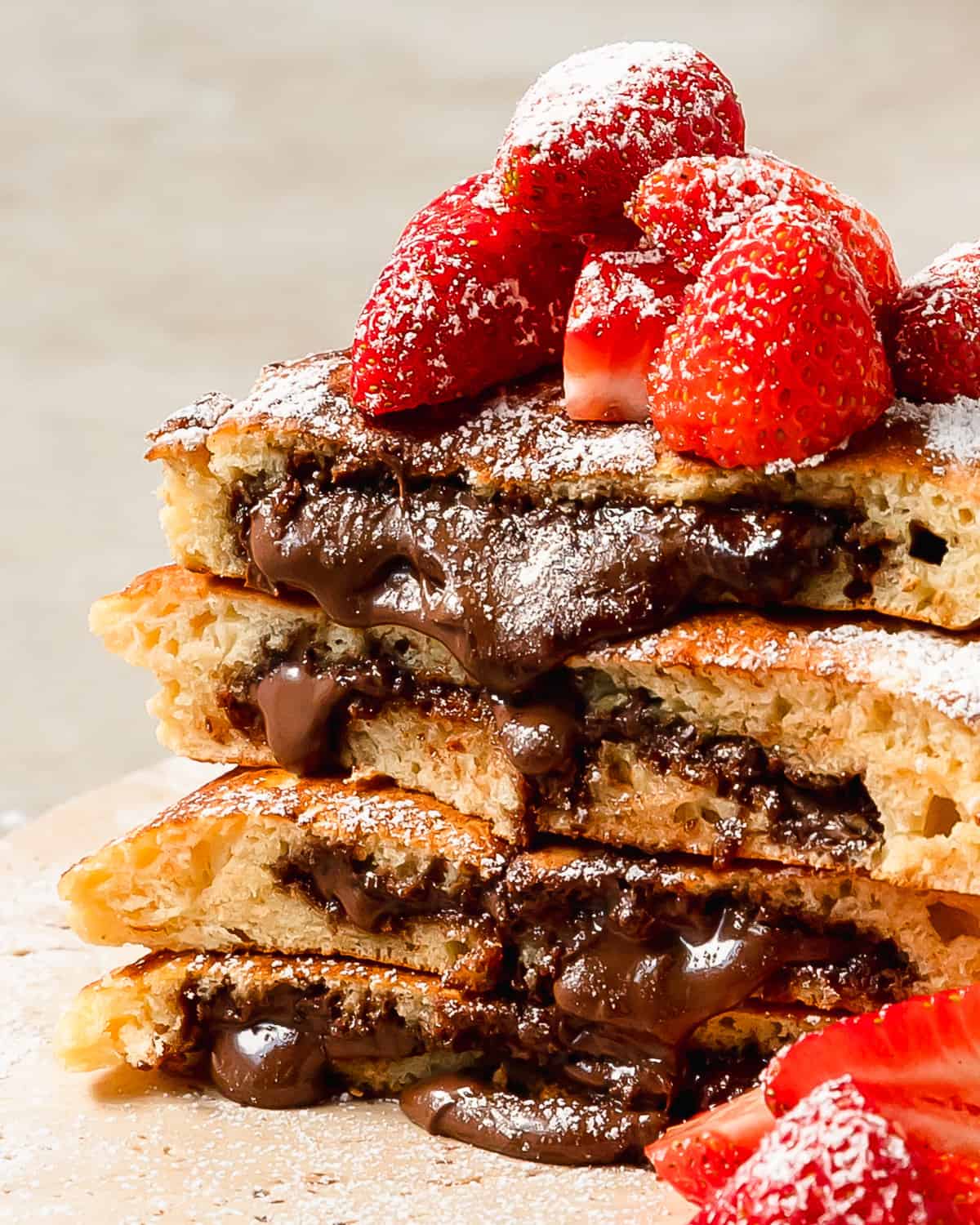 Nutella pancakes are light, fluffy and flavorful pancakes stuffed with creamy Nutella. Learn how to make these decadent and incredibly delicious Nutella stuffed pancakes in a few easy steps. A stack of these from homemade pancakes with Nutella makes the perfect special breakfast everyone will love. 