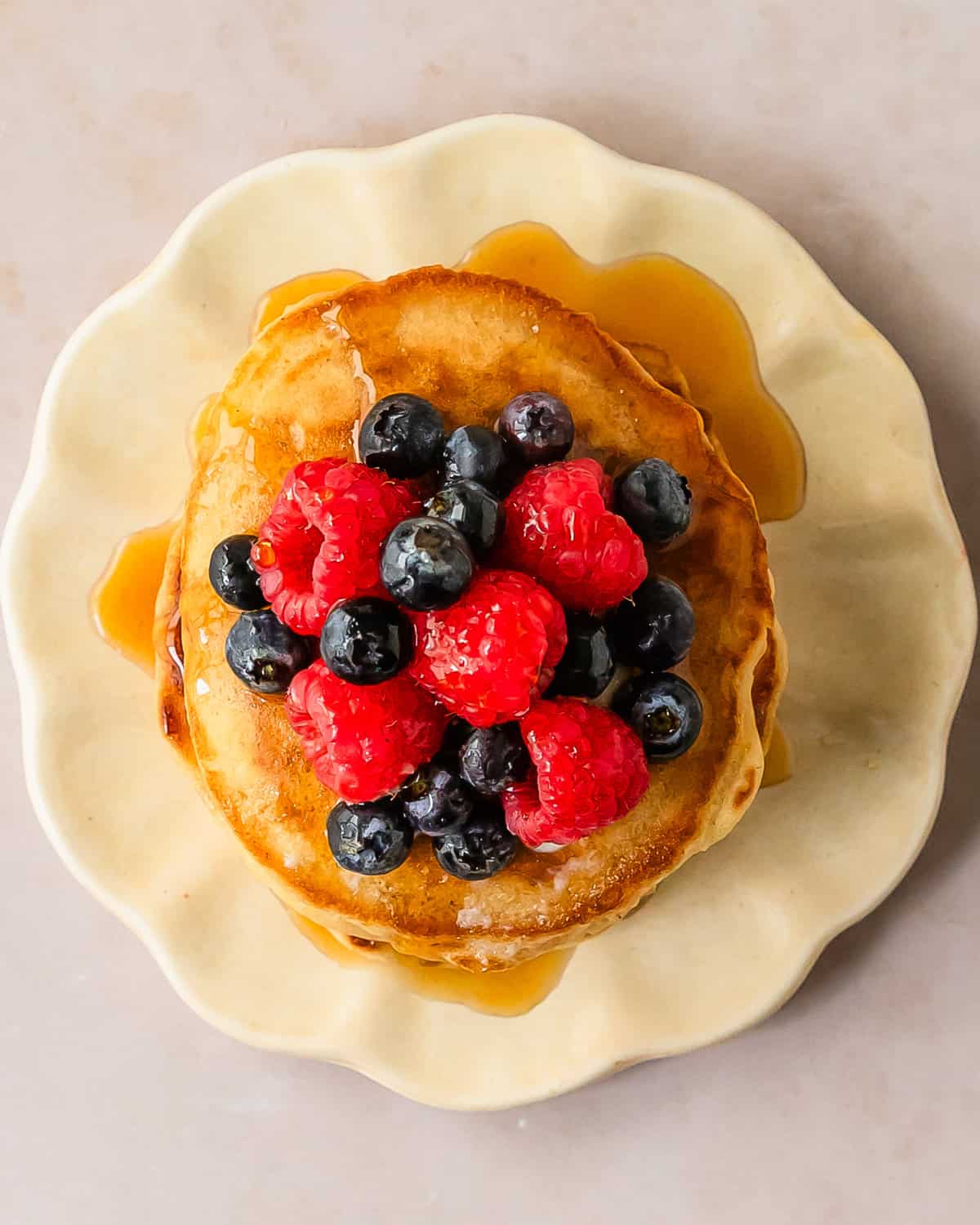 Learn how to make these quick and easy no milk pancakes using simple pantry ingredients and water as a substitute for milk. A stack of these from scratch pancakes makes the perfect cozy breakfast everyone will love, even if you don’t have milk. 