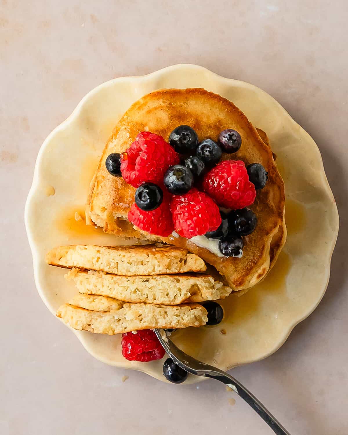 Learn how to make these quick and easy no milk pancakes using simple pantry ingredients and water as a substitute for milk. A stack of these from scratch pancakes makes the perfect cozy breakfast everyone will love, even if you don’t have milk. 