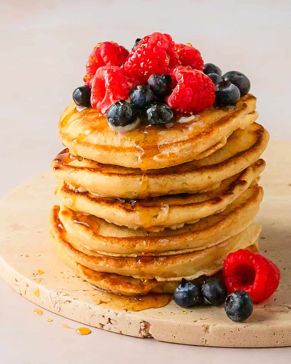Pancakes without milk are are so light, fluffy and flavorful homemade pancakes made without milk. Learn how to make these quick and easy no milk pancakes using simple pantry ingredients and water as a substitute for milk. A stack of these from scratch pancakes makes the perfect cozy breakfast everyone will love, even if you don’t have milk. 