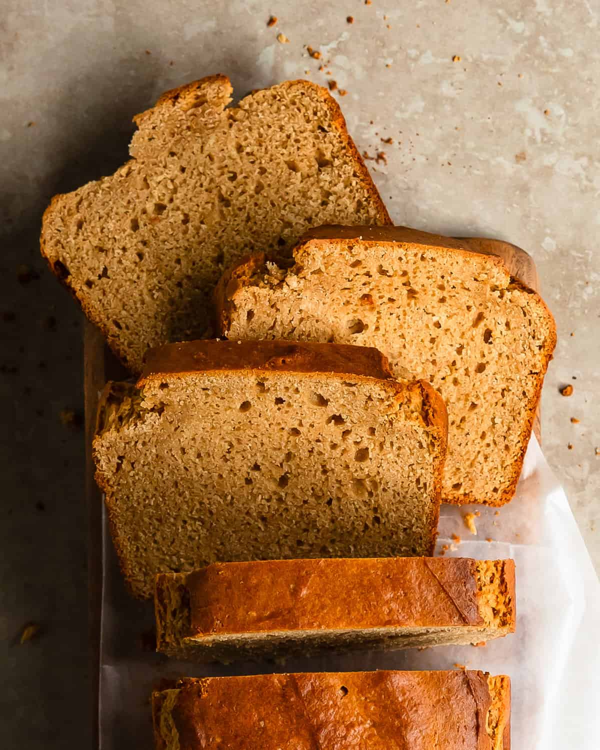 Peanut butter bread is an easy to make peanut butter quick bread with a soft, moist and nutty interior and a wonderfully toasted exterior. This peanut butter bread recipe is inspired by the simple and minimal ingredient recipes from depression era. Make this old fashioned peanut butter bread truly decadent by topping it your favorite spread such as peanut butter and honey.