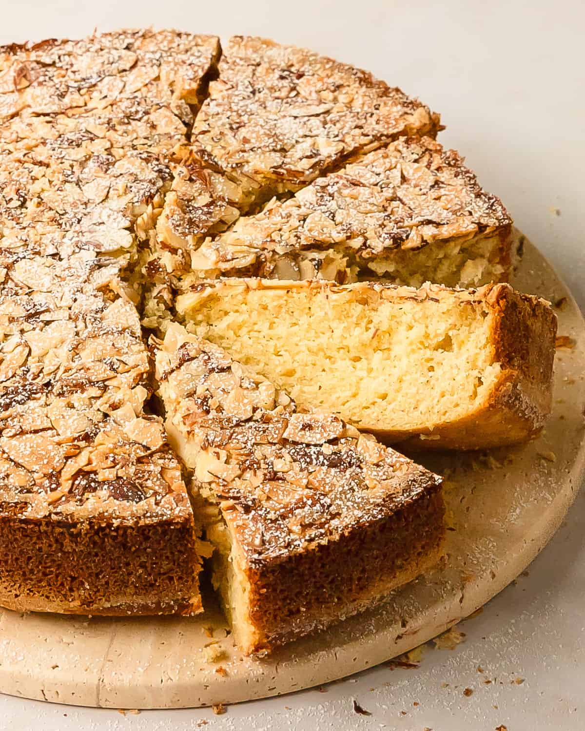 Cardamom cake is a traditional Swedish cardamom cake. This simple cardamom dessert has a buttery soft crumb and with a crunchy almond topping. Make this wonderfully easy cardamom cake recipe to pair with coffee or tea for your afternoon fika. 