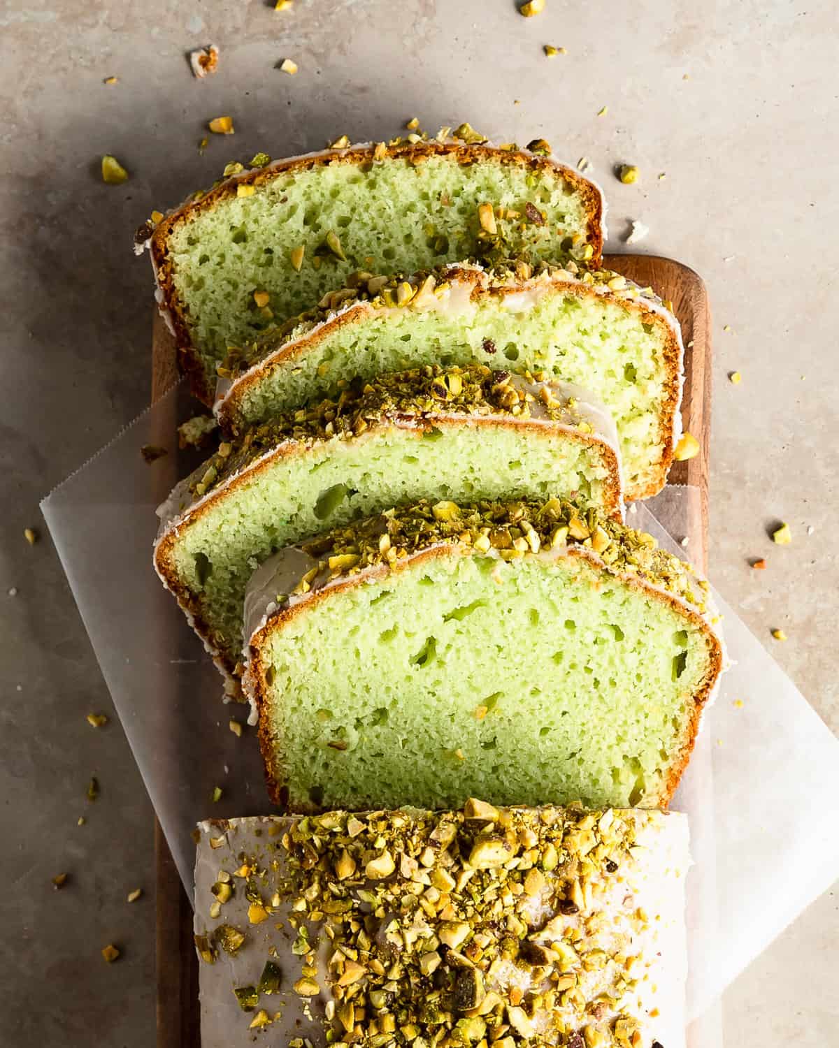 Pistachio bread is sweet, soft and moist pistachio quick bread made with pistachio pudding mix. Top this easy to make pistachio loaf with a nutty almond and vanilla glaze and real pistachios for a delightfully festive, sweet and salty treat. 