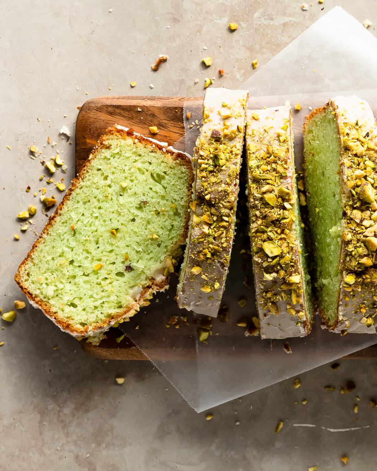 Pistachio bread is sweet, soft and moist pistachio quick bread made with pistachio pudding mix. Top this easy to make pistachio loaf with a nutty almond and vanilla glaze and real pistachios for a delightfully festive, sweet and salty treat.