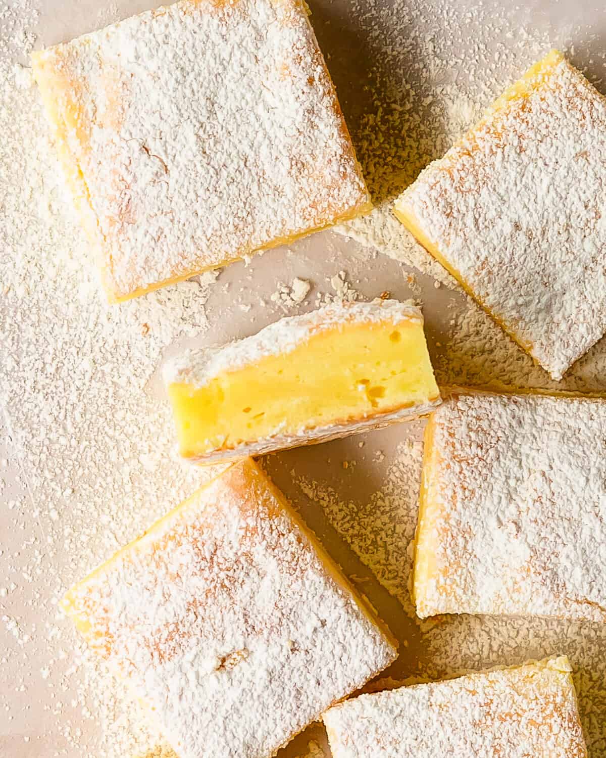 2 ingredient lemon bars are an impossibly quick and easy to make lemon dessert made from light and airy angel food cake mix and tart lemon pie filling. Top these lemon bars from cake mix with a dusting of sweet powdered sugar for a wonderfully refreshing dessert that’s made for spring and summer entertaining. 