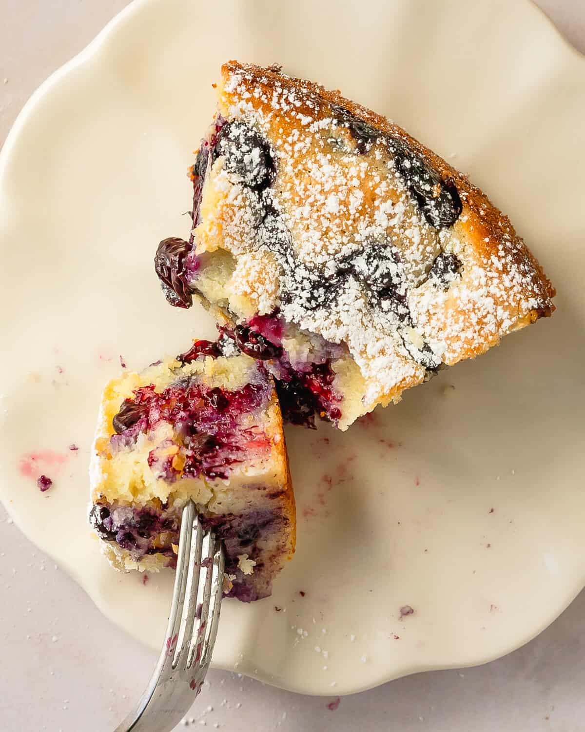 Blueberry ricotta cake is a deliciously sweet and moist Italian cake cake made with creamy ricotta and fresh blueberries. This easy to make blueberry lemon ricotta cake has a rich clafoutis like texture with a hint of bright lemon flavor. Make this ricotta blueberry cake for breakfast, dessert or anytime you need a simple, but stunning Italian cake.