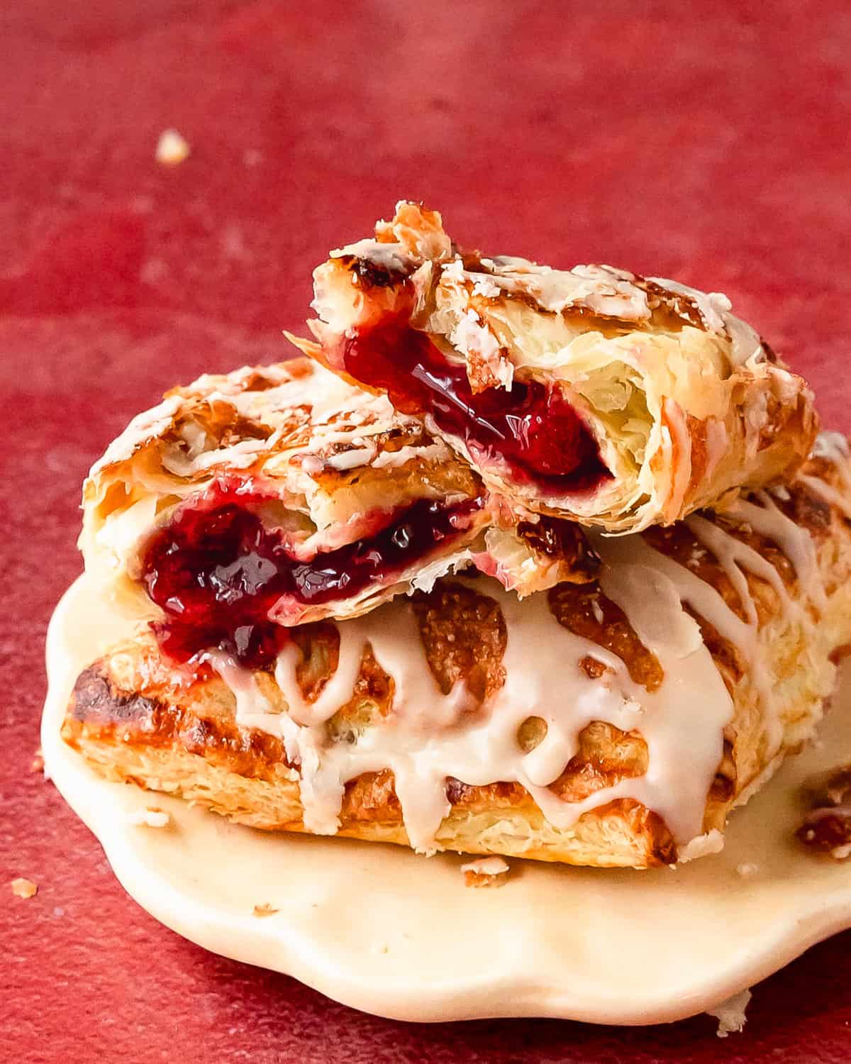Cherry turnovers are a baked cherry pastry made using flaky puff pastry filled with sweet cherry pie filling. Top these buttery cherry puff pastry turnovers with a creamy vanilla glaze. They’re the perfect quick and easy breakfast or dessert. 