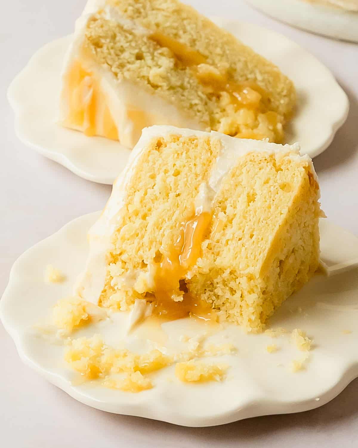 Lemon curd cake is a fresh and flavorful moist lemon cake with layers of creamy tart lemon curd, frosted with a sweet, creamy and tangy lemon cream cheese frosting.  With it’s beautiful bakery worthy appearance and easy preparation, this lemon cake with lemon curd is the perfect cake for all your spring and summer gatherings. 