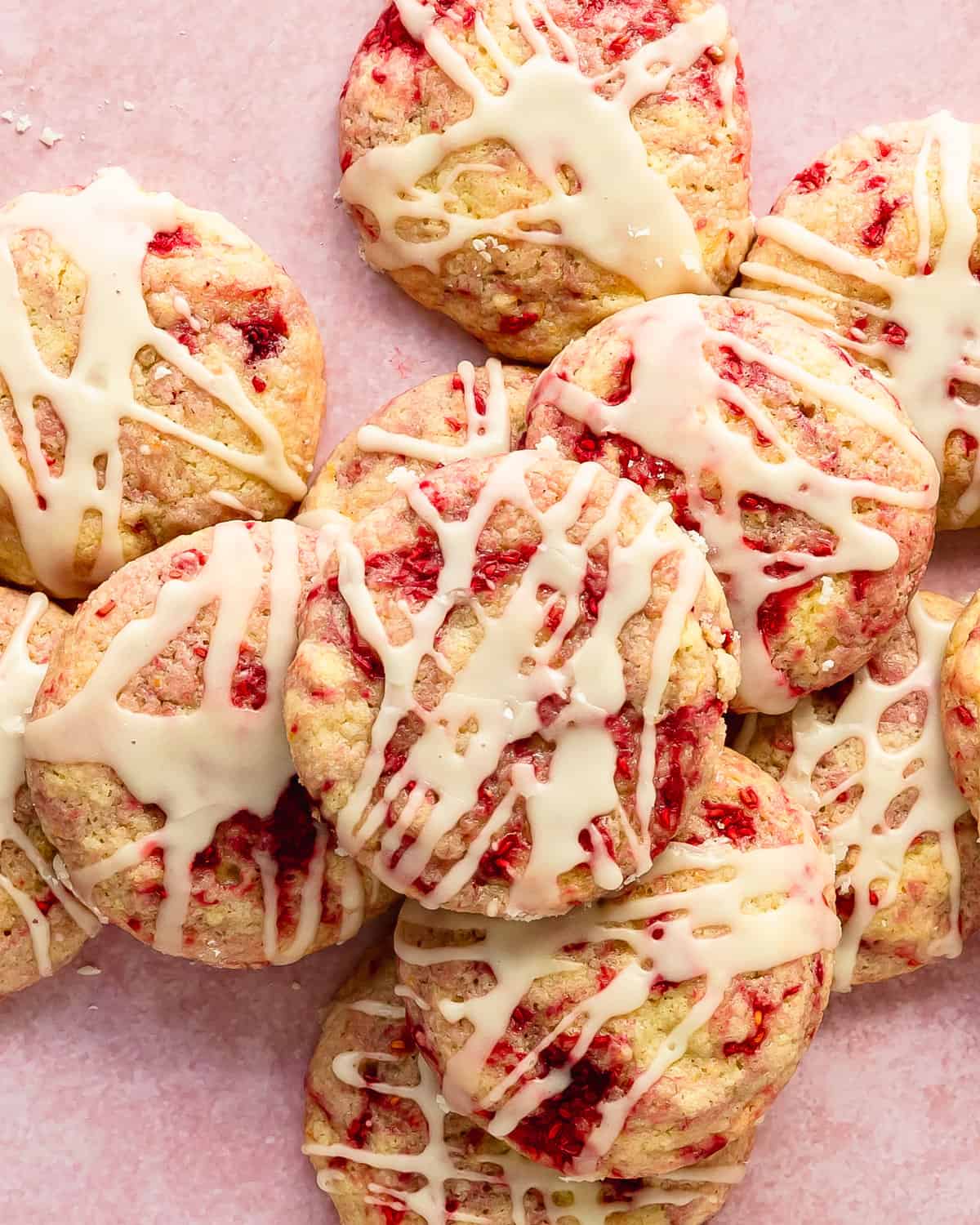 Lemon raspberry cookies are sweet. buttery, soft and fluffy lemon cookies filled with swirls of tart raspberries. Top these raspberry lemon cookies with a fresh lemon glaze for even more lemon flavor. This lemon and raspberry cookie recipe is no chill and easy to make in one bowl. 