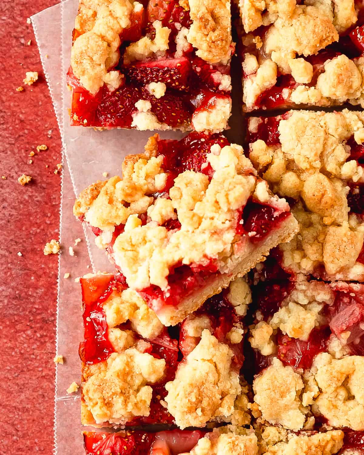 Strawberry bars are wonderfully delicious cookie crumble bars made with a press in shortbread crust, fresh strawberry filling and a buttery crumb topping. These strawberry crumb bars are quick and easy to make using a few simple ingredients. Make this easy strawberry dessert for the the perfect, refreshing treat to enjoy on a hot day.